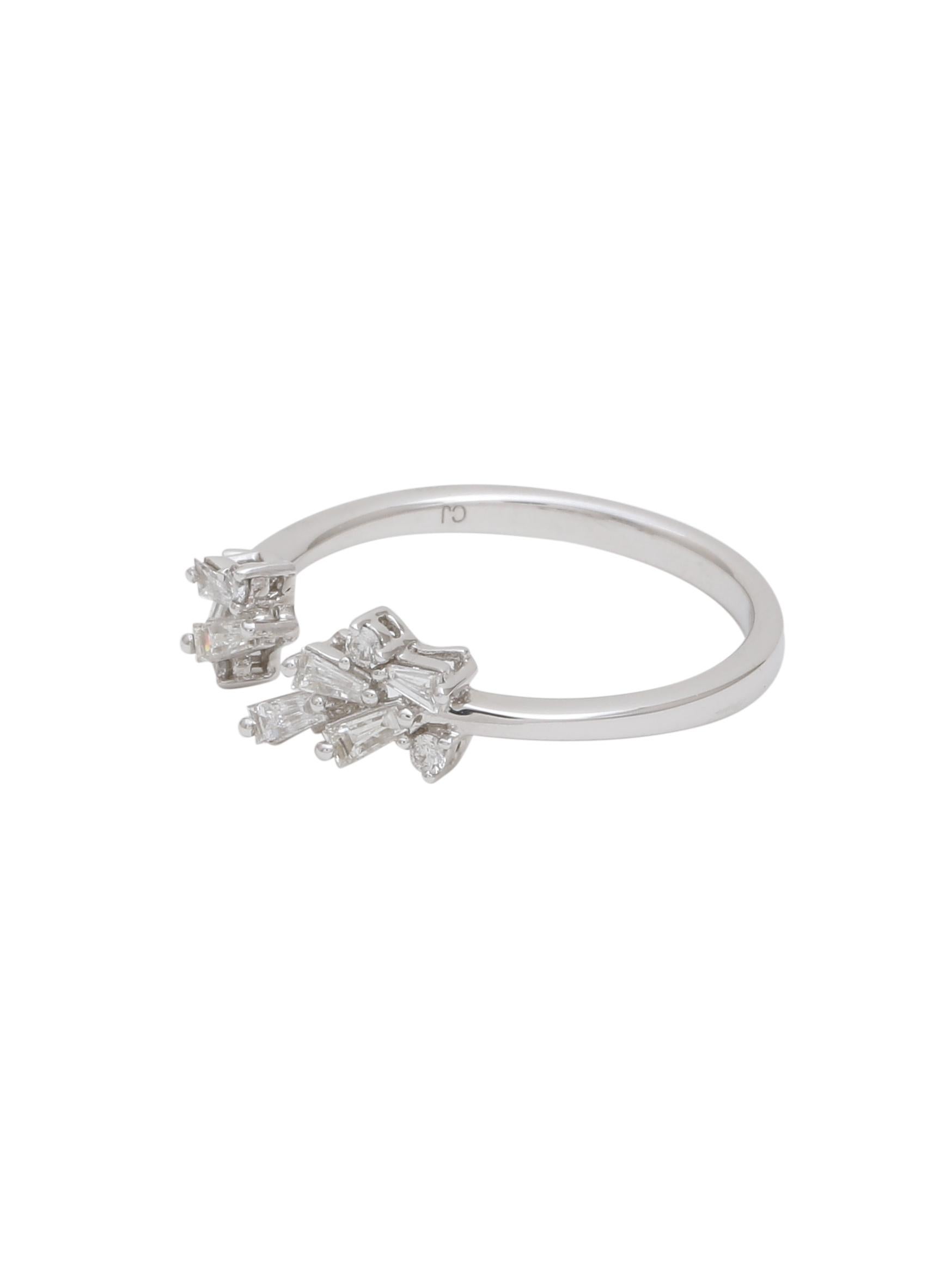 A pretty petit Diamond ring with small Diamond baguettes and Diamond Rounds are set together with a gap in the middle. A very modern and light weight design which is dressy yet good for everyday wear. 
The Diamond baguettes in the ring weigh 0.21