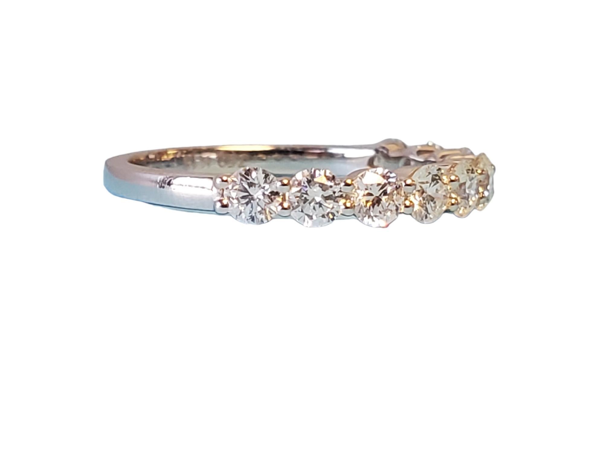 18k White gold half eternity band - closeout piece. Unworn, gorgeous half eternity band. This band features 1.00tcw white vs diamonds that exhibit fire and scintillation. The size is 6.5, ready to wear