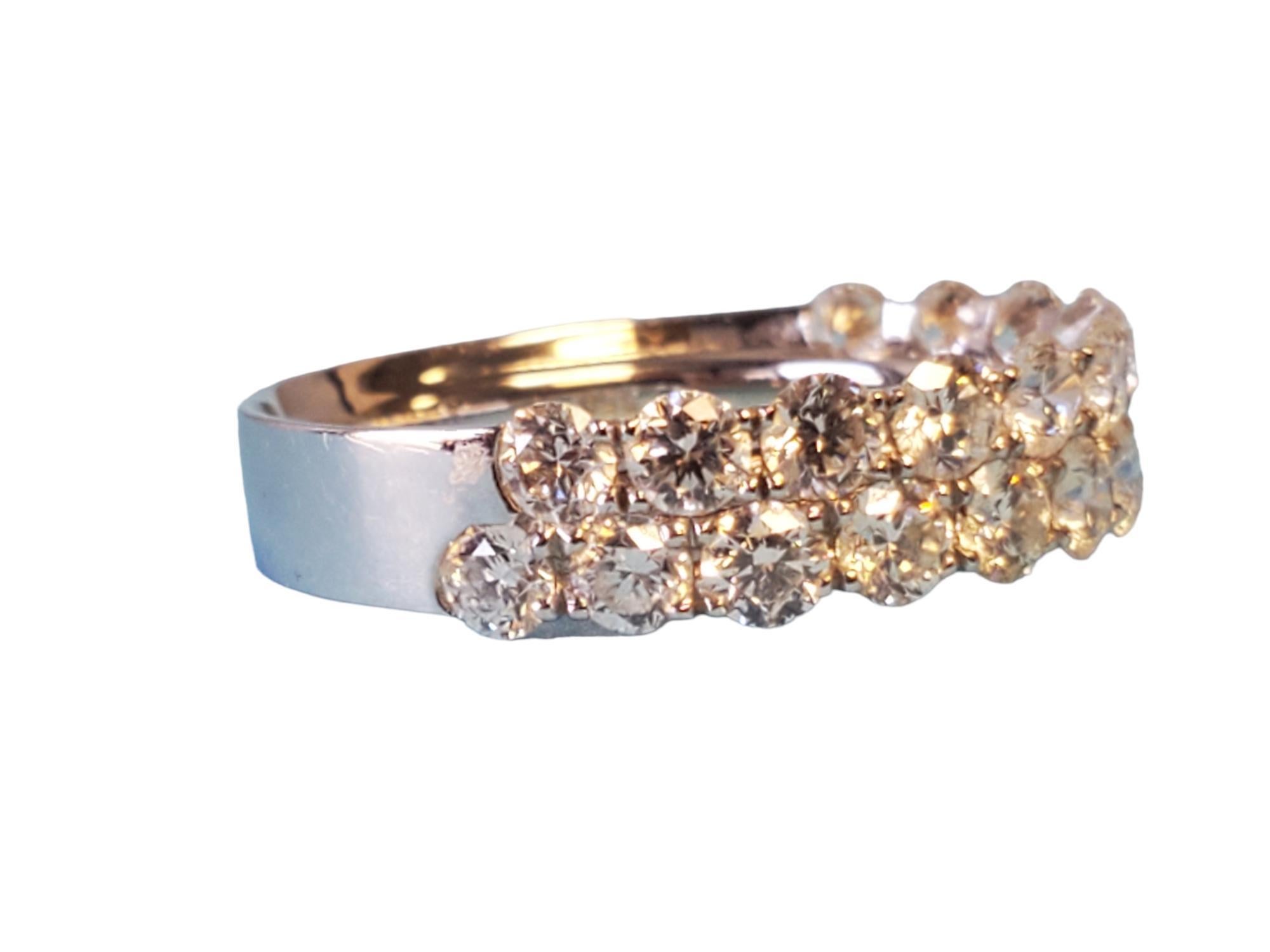 18k White gold half eternity band - closeout piece. Unworn, gorgeous 2 row diamond band that goes halfway around the ring. This band features 2.00tcw white vs diamonds that exhibit fire and scintillation. The size is 6.75, ready to wear.