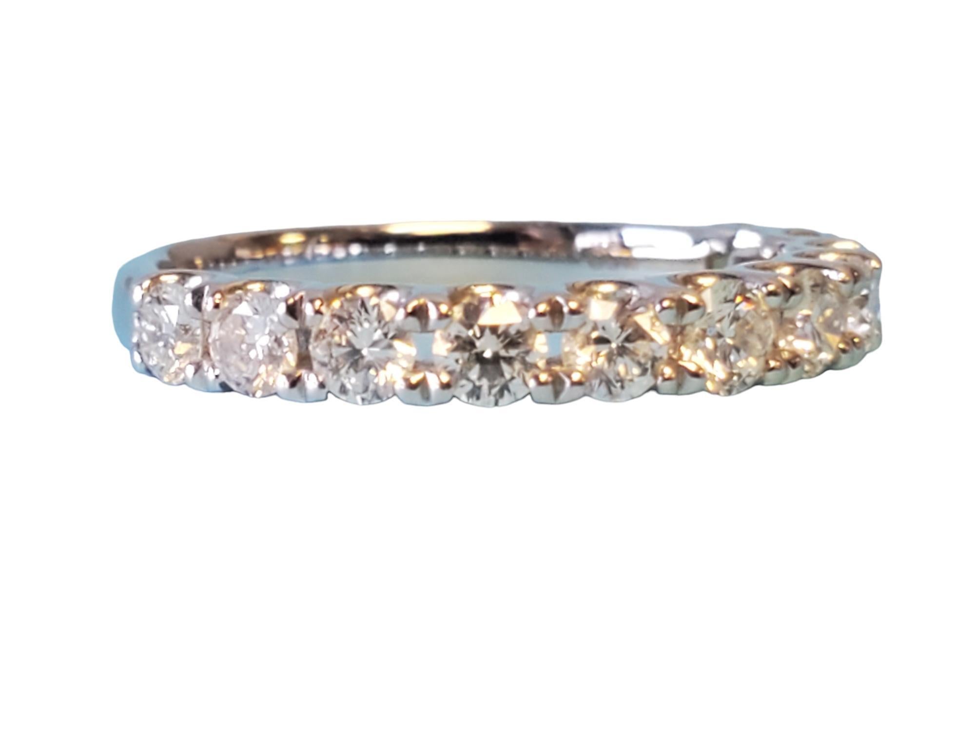 18k White gold half eternity band - closeout piece. Unworn, gorgeous half eternity band. This band features 1.00tcw white vs diamonds that exhibit fire and scintillation. The size is 6.75, ready to wear.