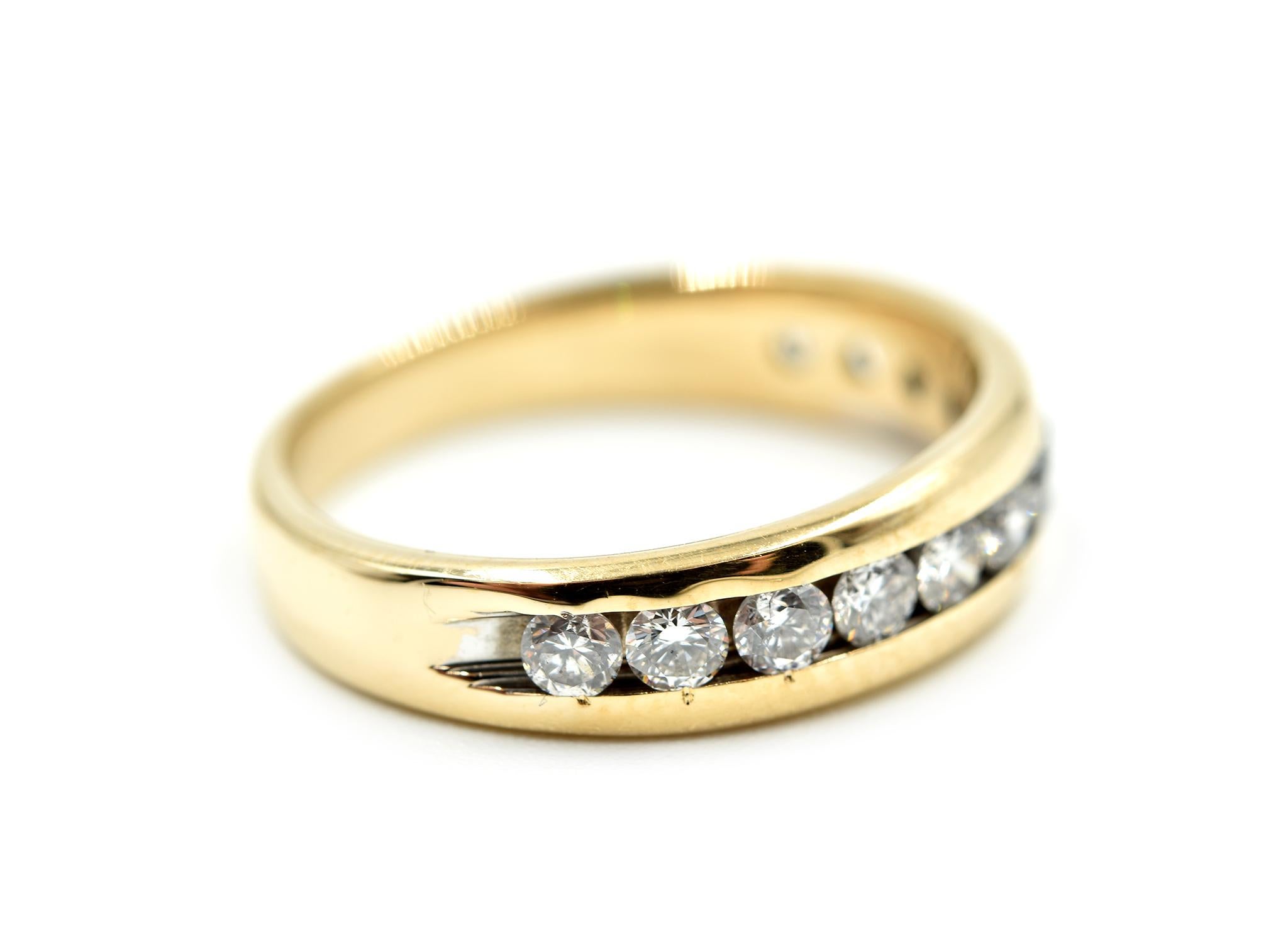 Designer: custom design
Material: 14k yellow gold
Diamonds: 12 round brilliant cuts = 0.72 carat total weight
Dimensions: ring top is 4.65mm long
Ring size: 5
Weight: 2.90 grams

