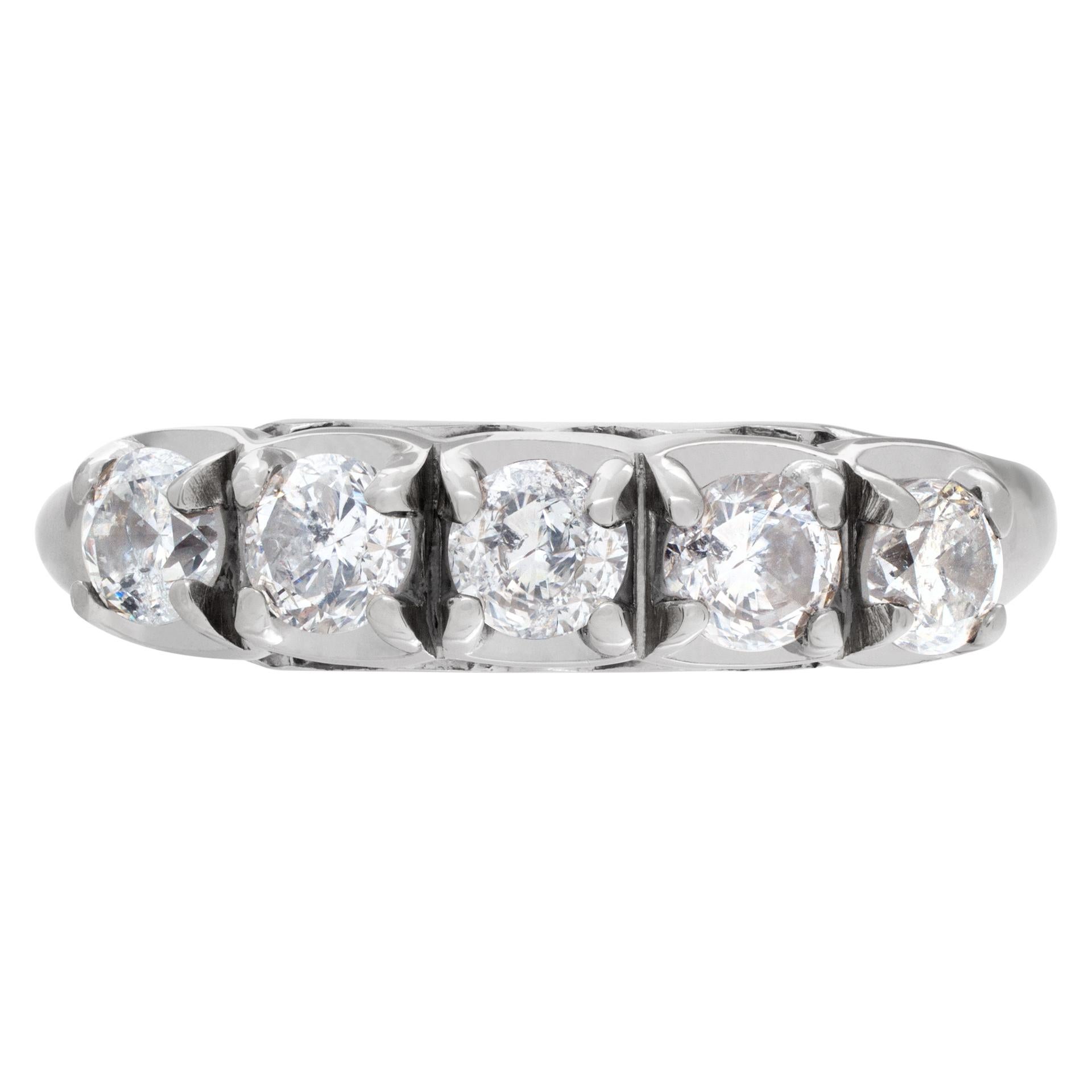 Diamond band in 14k white gold with approx. 1 carat. Size 6.75.

This Diamond ring is currently size 6.75 and some items can be sized up or down, please ask! It weighs 2.7 pennyweights and is 14k.