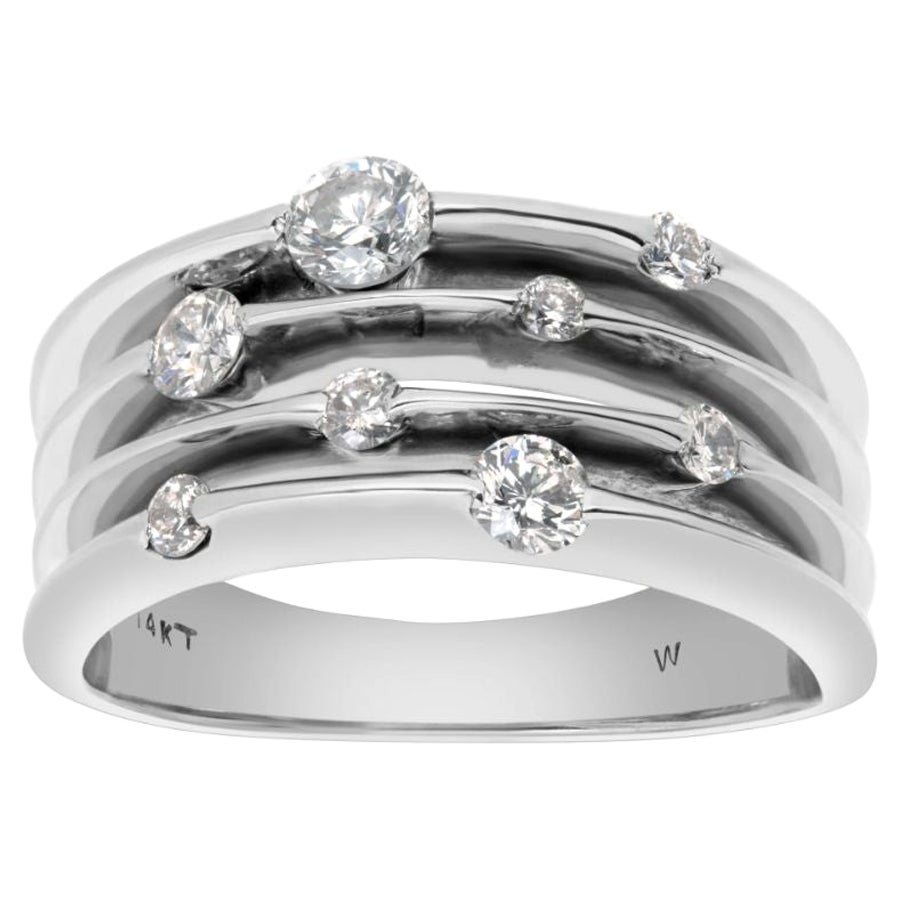 Diamantband aus 14 Karat Weißgold mit Diamanten in unterschiedlichen Größen als „Blumen“