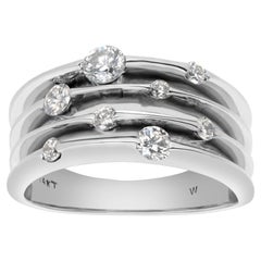 Diamantband aus 14 Karat Weißgold mit Diamanten in unterschiedlichen Größen als „Blumen“