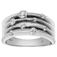 Diamond band in 14k white gold with different size diamond "bubbles"