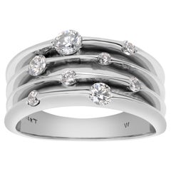 Diamantband aus 14 Karat Weißgold mit Diamanten in unterschiedlichen Größen als „Blumen“