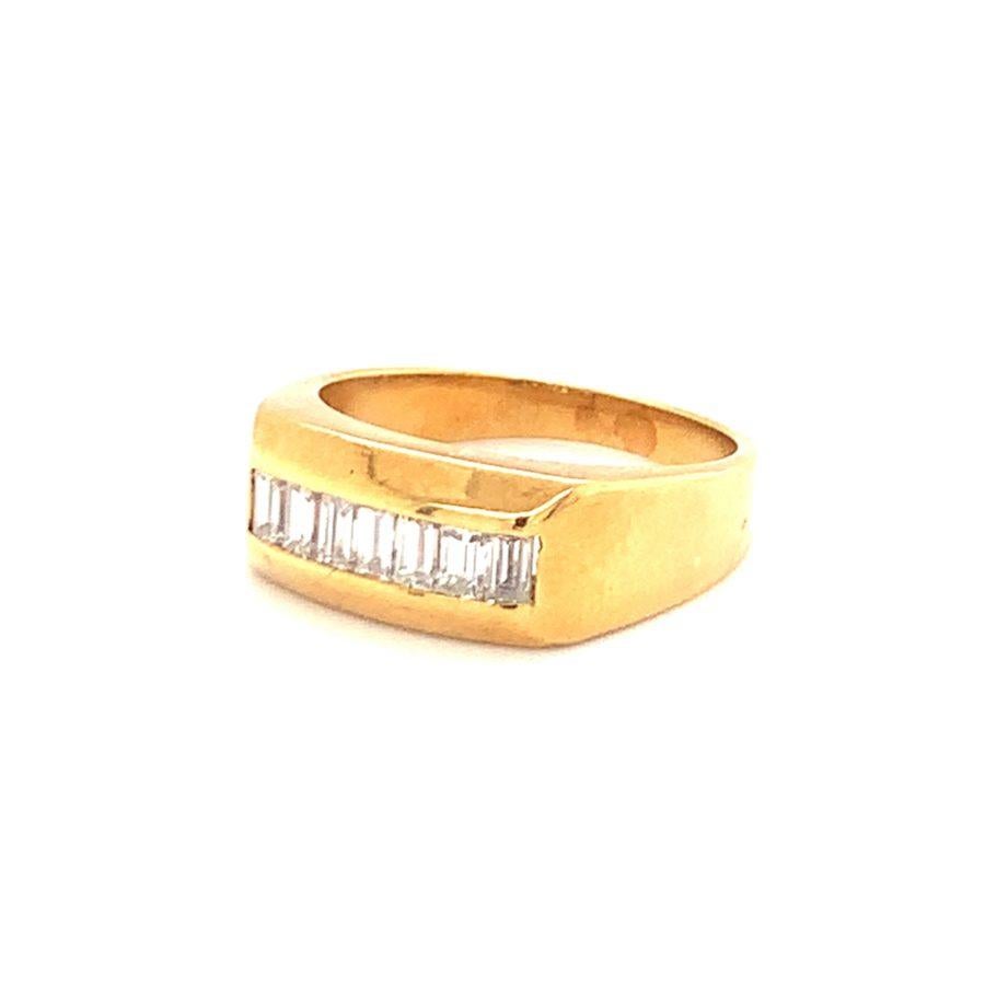 Diamond band in 18K yellow gold featuring 7 channel set, straight baguette diamonds totaling 1 ct., H color and VS-1, VS-2 clarity.

Sturdy, polished, brilliant.

Additional information:
Metal: 18K yellow gold
Gemstone: Diamonds totaling 1 ct., H /