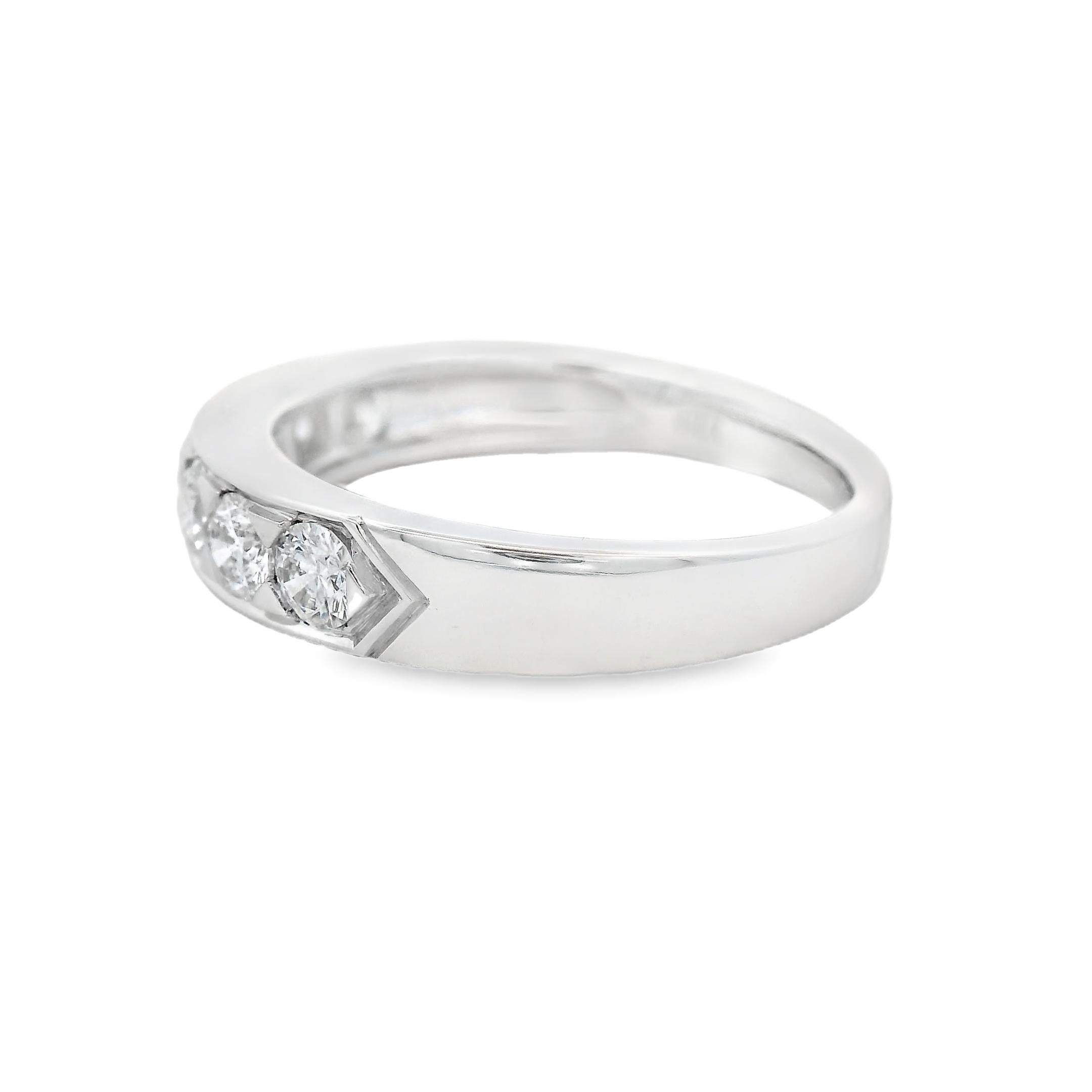 A modern diamond band ring crafted in polished 14K white gold, featuring seven round brilliant-cut diamonds channel-set across the top for a clean, seamless look. The diamonds total 0.88 carats, offering balanced sparkle with strong presence and