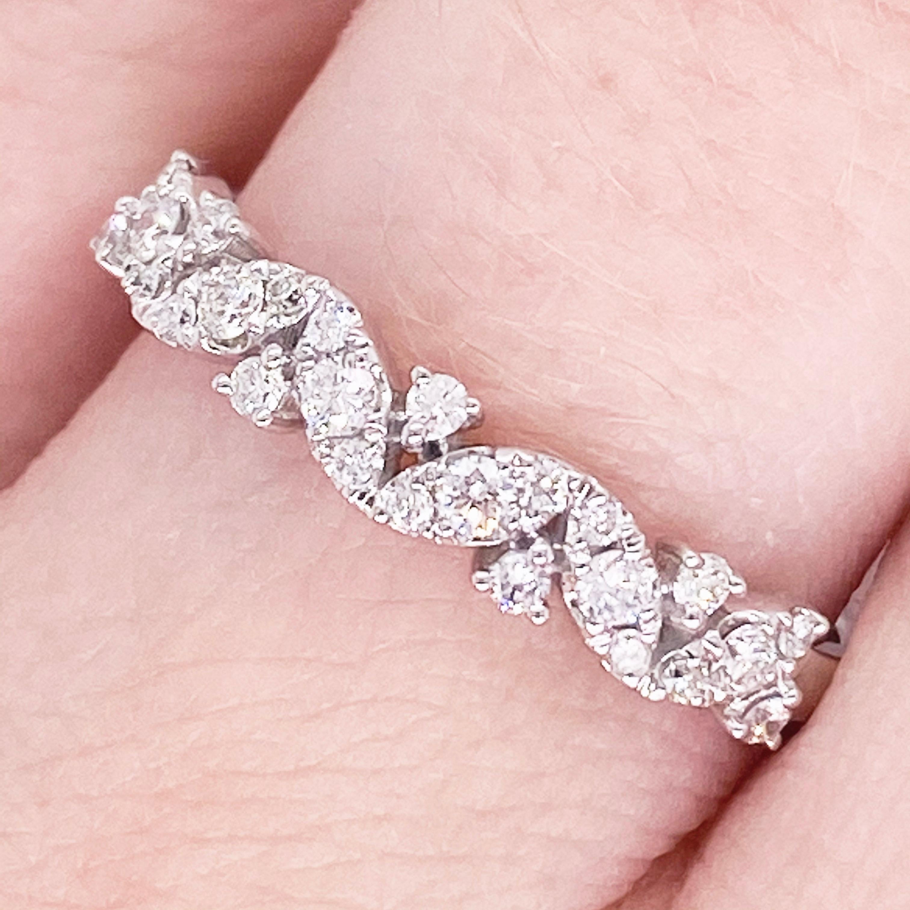 This stunningly beautiful diamond band ring would make anyone thrilled to receive it!  These brilliant diamonds set in polished 14k white gold provide a look that is very modern and classic at the same time! This ring is very fashionable  with a zig