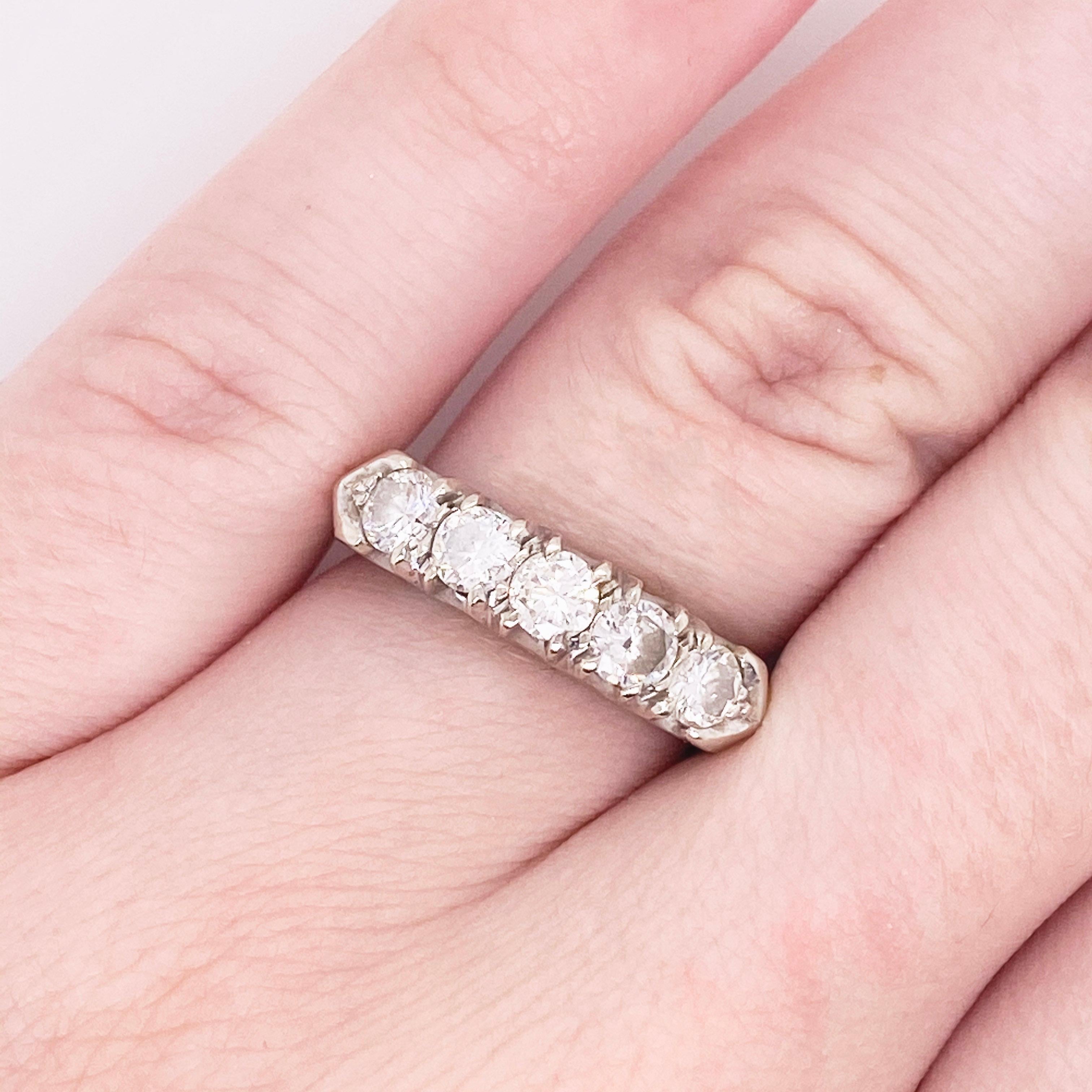 This stunningly beautiful diamond band ring would make anyone thrilled to receive it!  These brilliant diamonds set in polished 14k white gold provide a look that is very modern and classic at the same time! This ring is very fashionable and can add