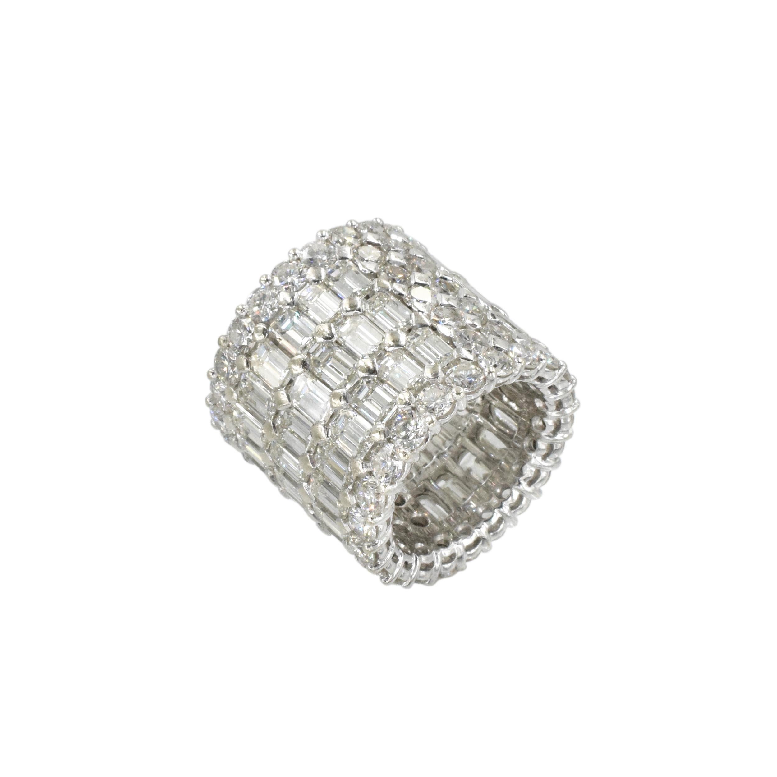Wide White Gold and Diamond Band Ring This 5-row wedding band with 19.5 carats of fine diamonds is centering three rows of 54 cut cornered fine quality emerald-cut diamonds with total weight of approximately 12.00 carats, edged and spaced by 64