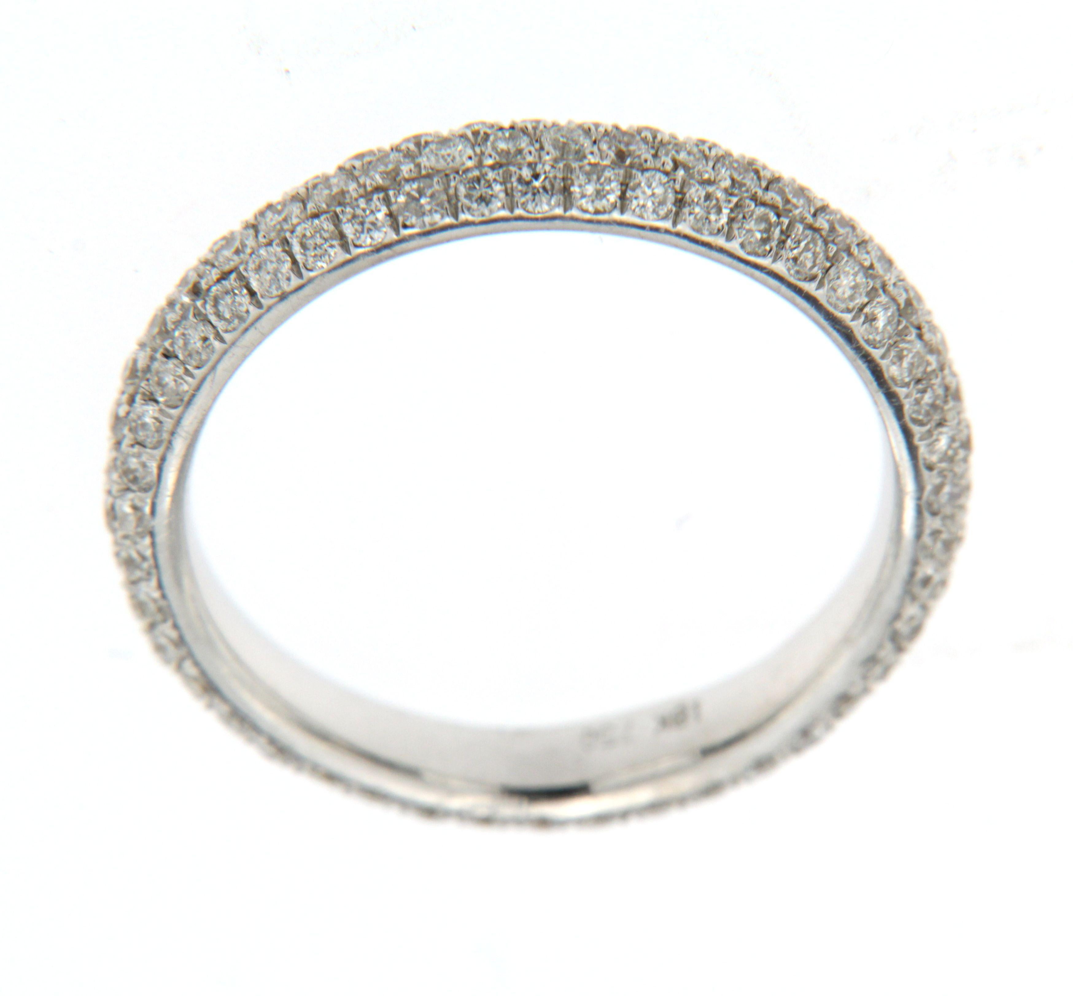 Timeless elegance meets modern simplicity in this sparkling pavé band ring. Crafted in 18 karat white gold, the design features 1.08 carats of white round brilliant diamonds, meticulously set in three delicate rows across the top of the band. Each