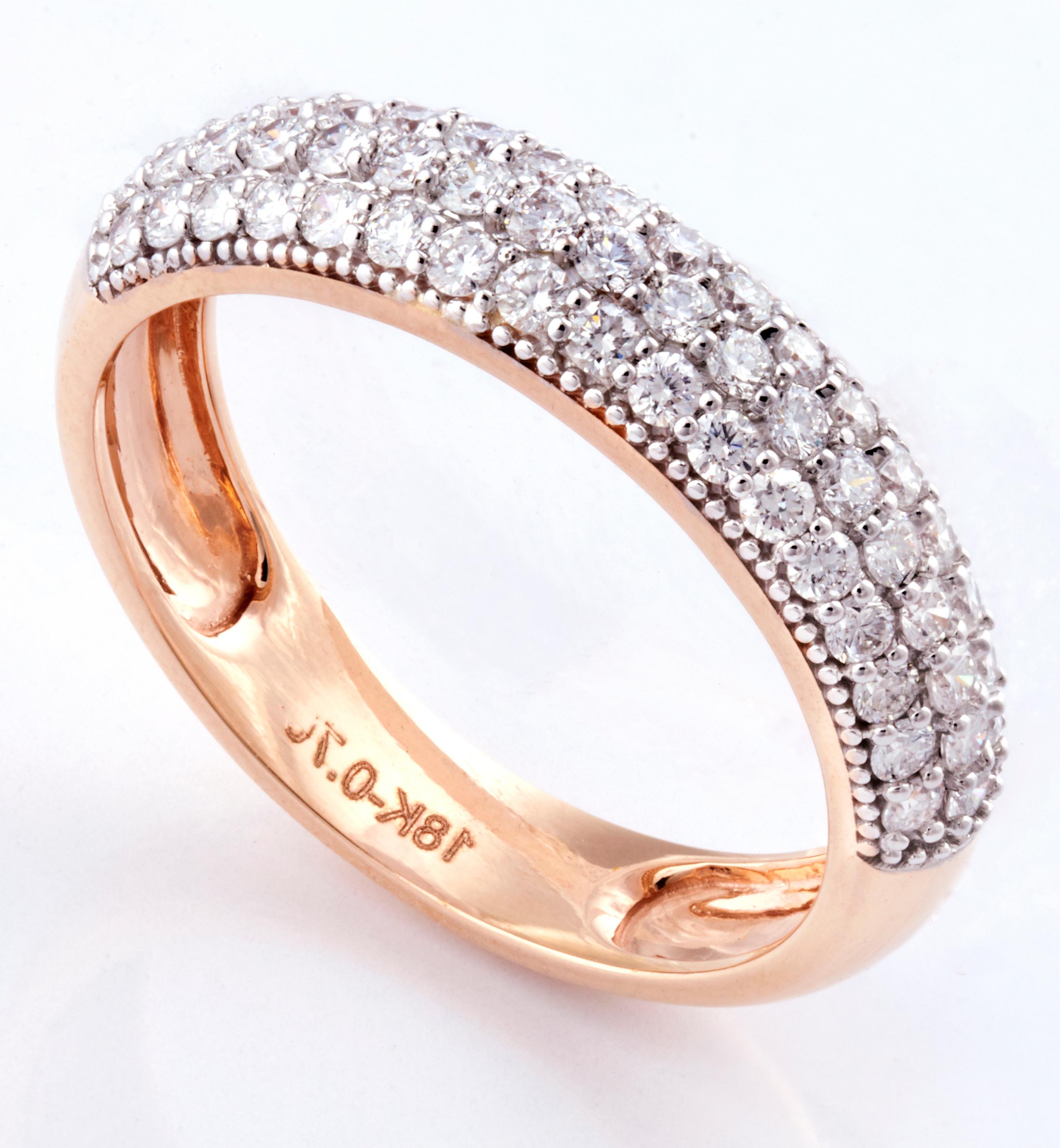 A Classic micro-pavé Diamond band set in 3.99 grams of 18k Rose Gold with 52 round cut diamonds studded around in VS/G quality and colour weighing 0.70 carats. 

These diamonds have been carefully picked and selected from authentic sources and