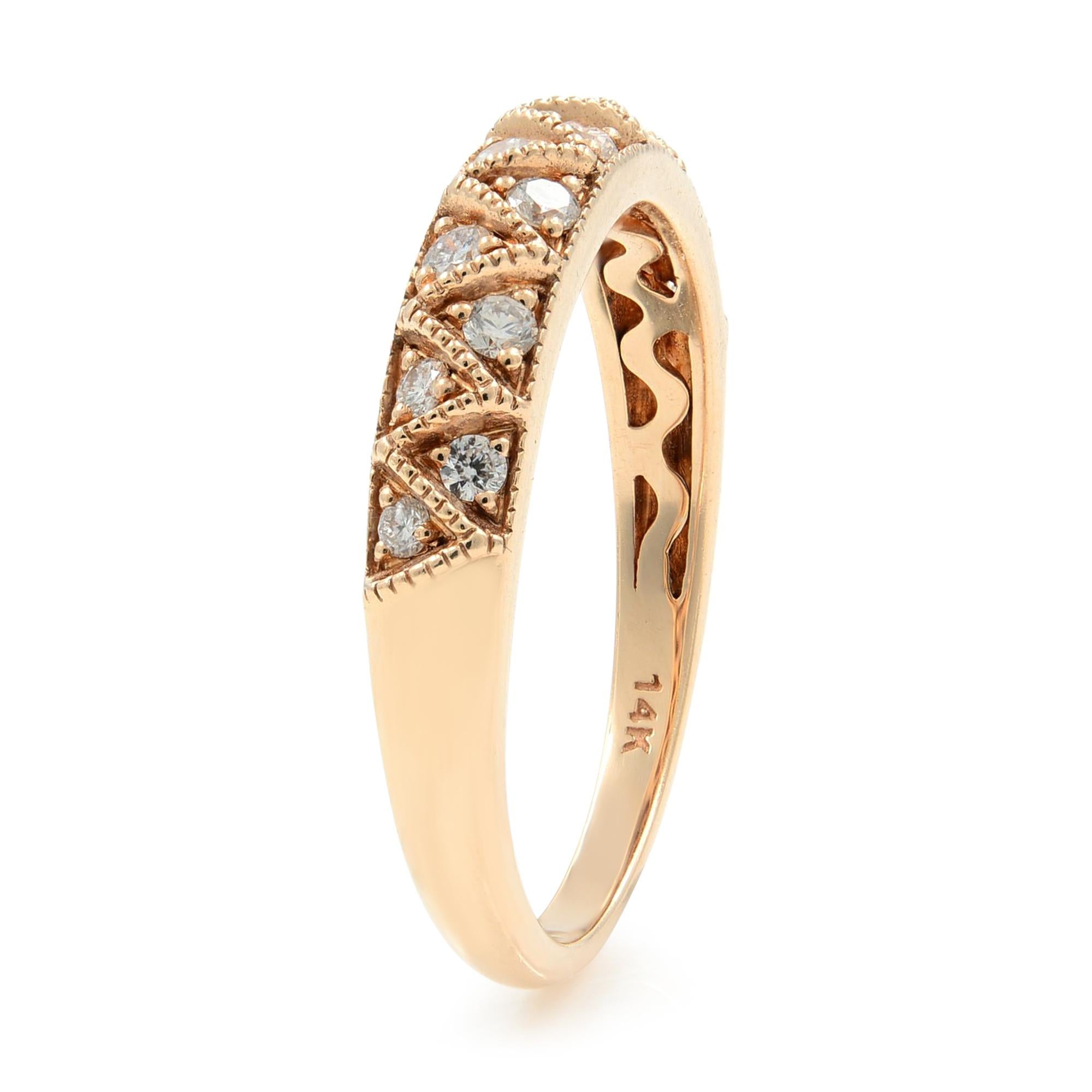 This gorgeous petite diamond band ring is crafted in 14k rose gold with 14 dazzling round cut diamonds set in a milgrain design that gives the ring a very unique feminine style. The ring is size 7.25 and weighs 2.84 grams. Presentable gift box