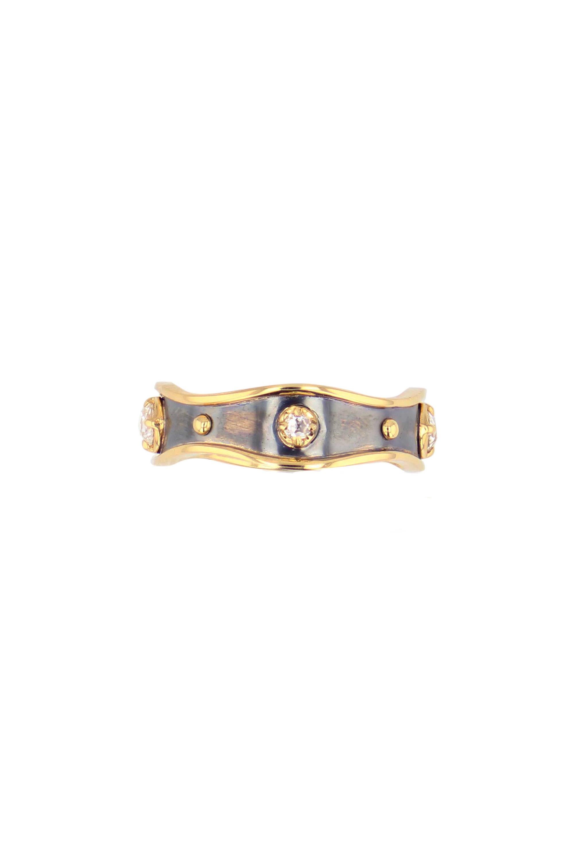 Yellow gold and distressed silver ring  studded with rose-cut diamonds.

Details:
4 Diamonds: 0,2 cts
18k Yellow Gold : 2 g    
Distressed Silver : 0,2 g 
Made in France