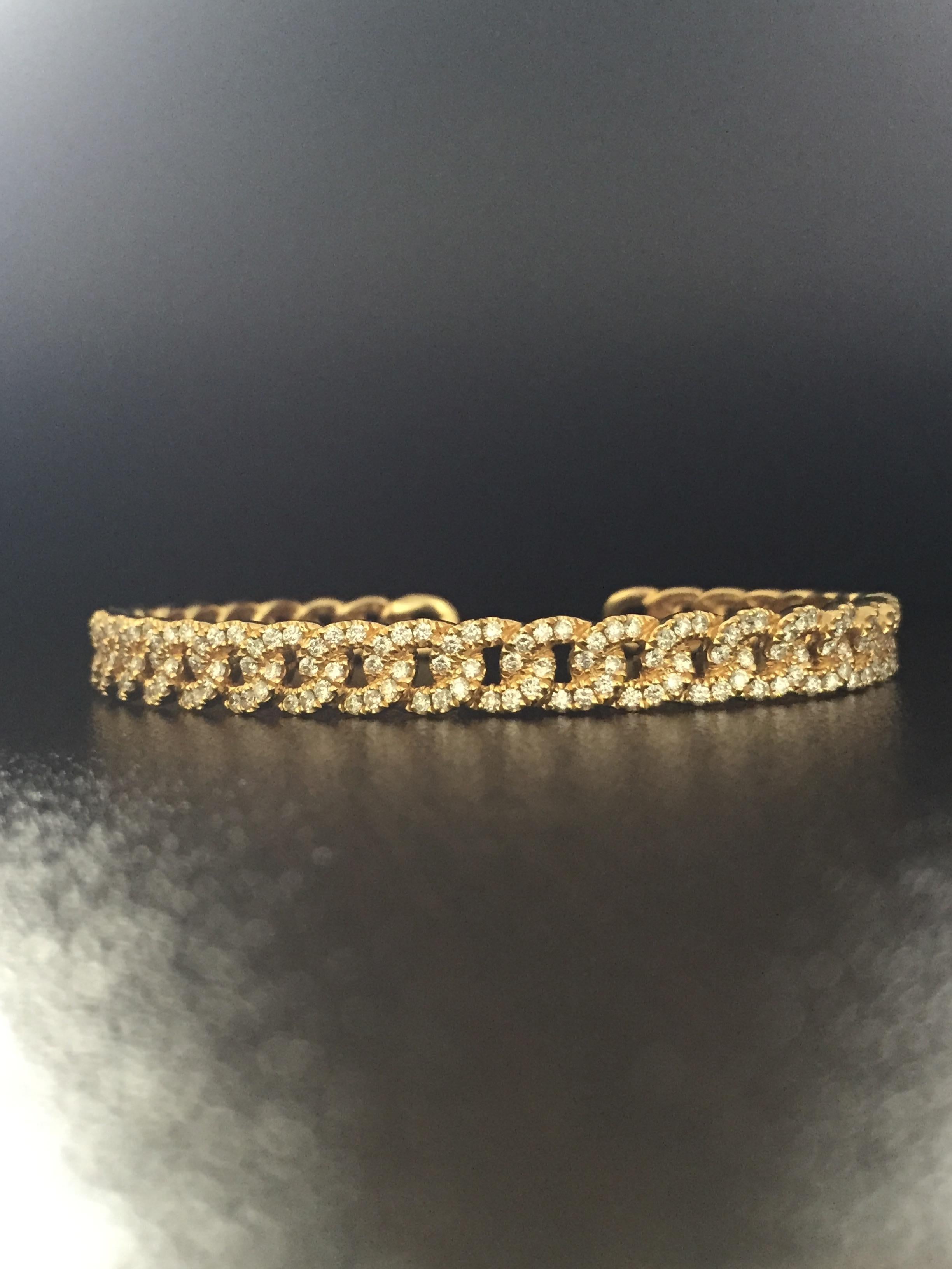 Italian made Diamond cuff bangle set in 18K yellow gold. The diamonds are set in a 
