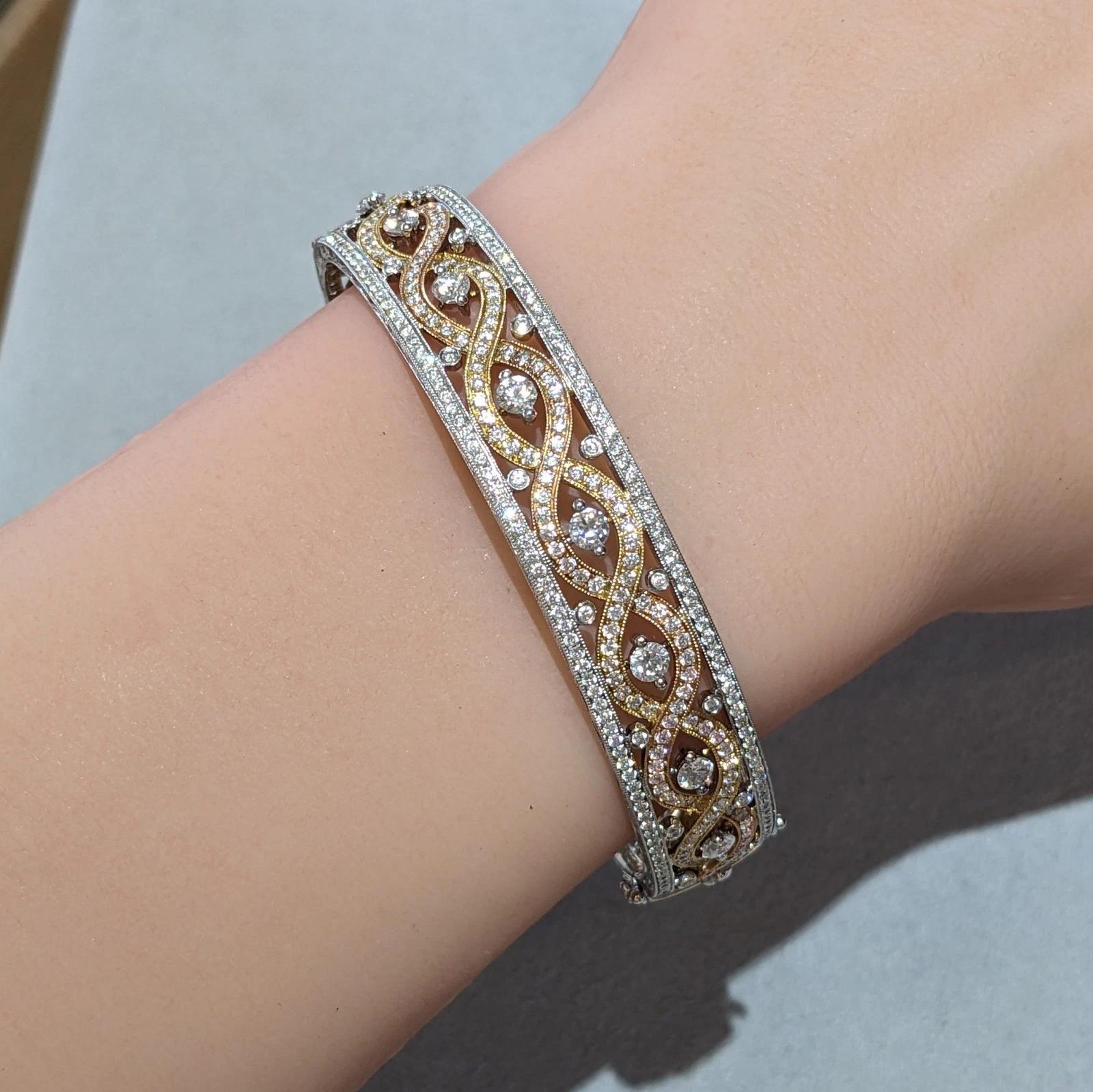 Diamond Bangle Bracelet 3.00 carat total weight by Supreme in 18k Tricolor Gold 

Diamond Bangle features a top half set with Round Brilliant Diamonds in 18k Yellow, White, and Rose Gold with milgrain details by Supreme. The back half of the bangle
