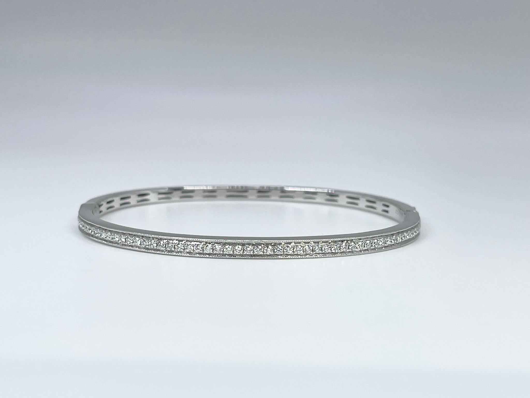 Diamond Bangle bracelet in 14KT white gold, very well crafted with a luxurious touch of perfection.

GRAM WEIGHT: 14.50gr
METAL: 14KT white gold

NATURAL DIAMOND(S)
Cut: Round 
Color: G (average)
Clarity: VS-SI (average)
Carat: 0.70ct
Length: 2.3