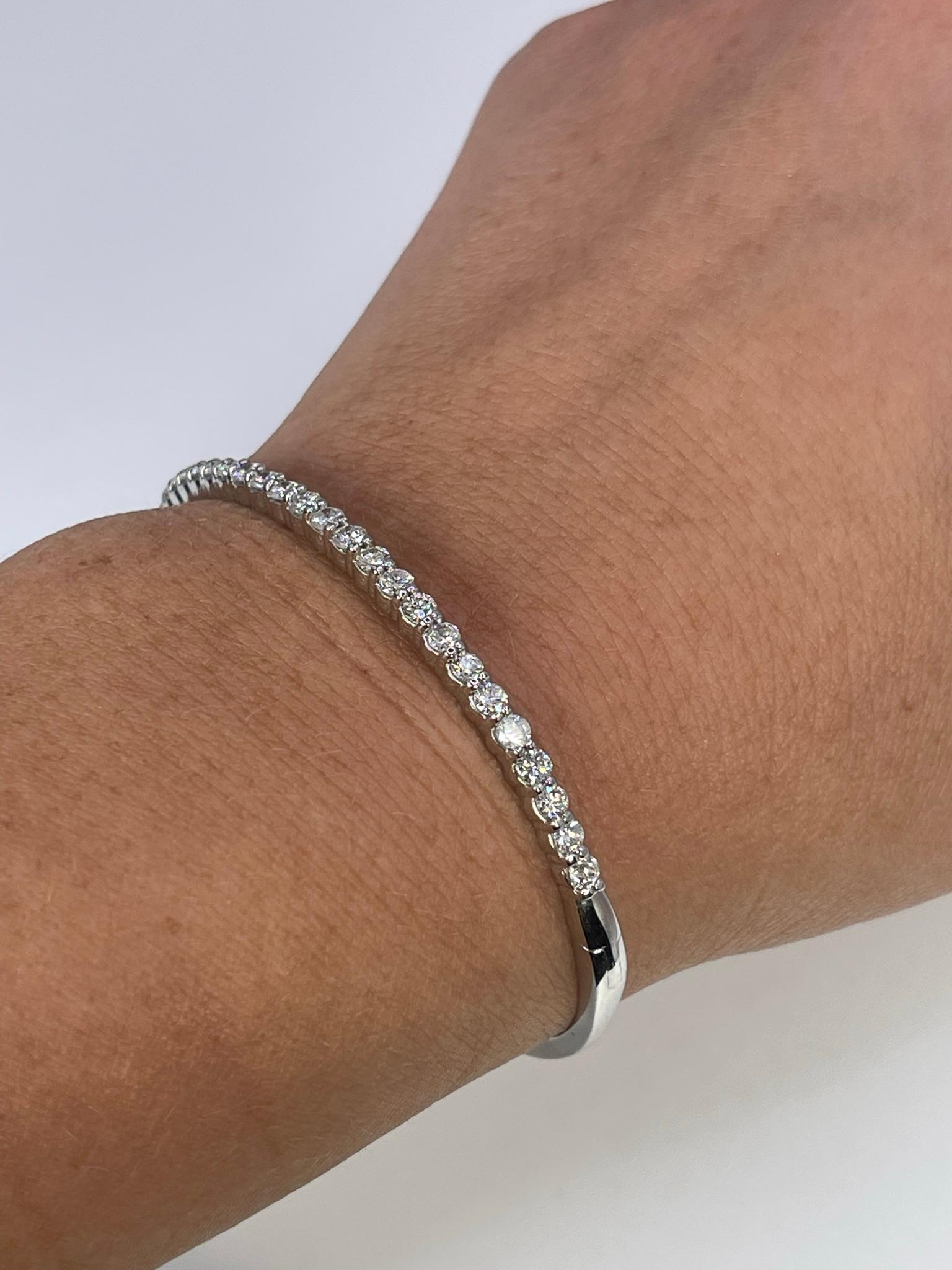 Diamond Bangle bracelet in 14KT white gold, very well crafted with a luxurious touch of perfection.

GRAM WEIGHT: 14.50gr
METAL: 14KT white gold

NATURAL DIAMOND(S)
Cut: Round 
Color: G (average)
Clarity: VS-SI (average)
Carat: 0.70ct
Length: 2.3