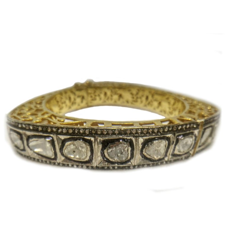 Mughal inspired diamond bangle. Handcrafted fancy cut and tabular cut natural diamonds mounted in bezel setting, accented with small diamonds in micro pave setting, and oxidized bangle border. Beautiful triangular design bangle made in silver with