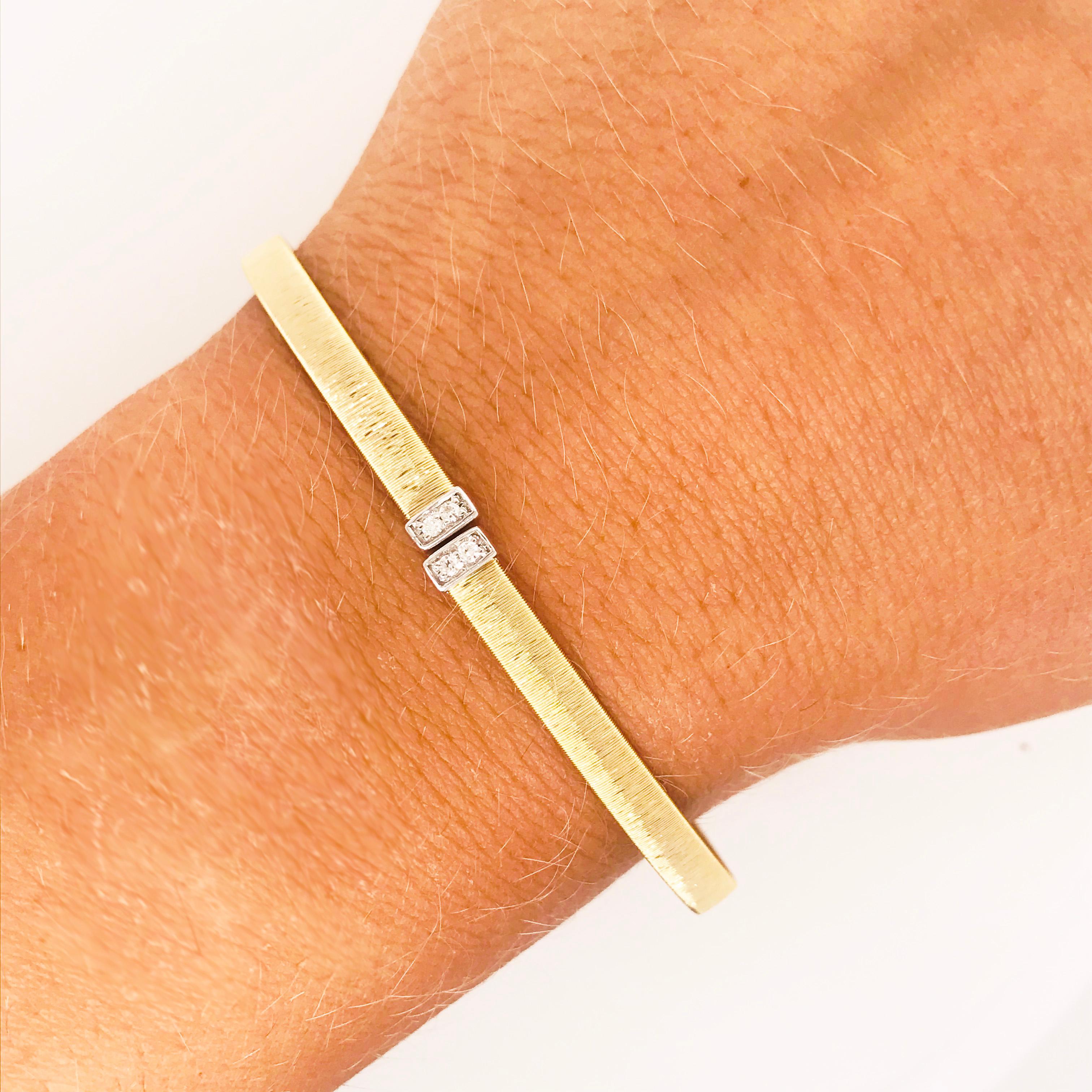 This 14 karat yellow gold satin cuff bangle bracelet is flexible and easy to put on and secure once you get it on!  This bracelet is a very modern, design that touts quality and an eye for style.  There is a white gold, rectangle that has a total of