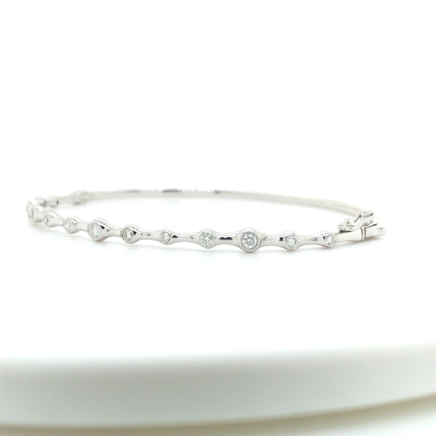 Beautiful and unique diamond bangle bracelet with 13 diamonds with a total carat weight of .37cts G color and VS2 clarity. Love this everyday bangle it by itself or stacked. 
