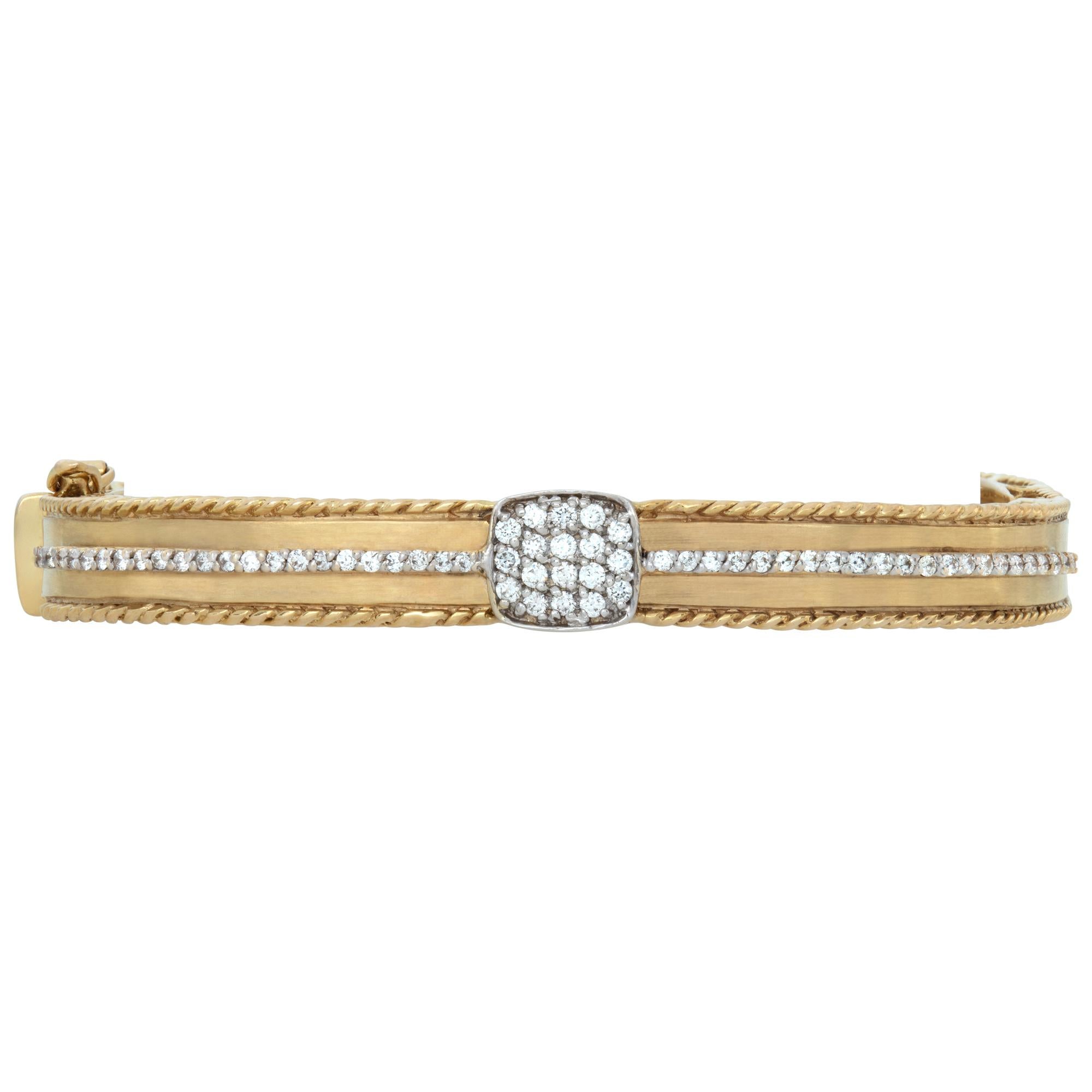 Diamond bangle in 14k yellow gold with approximately 1 carat in G-H color, VS clarity diamonds. Fits 6-7 inches wrist, width 8mm.