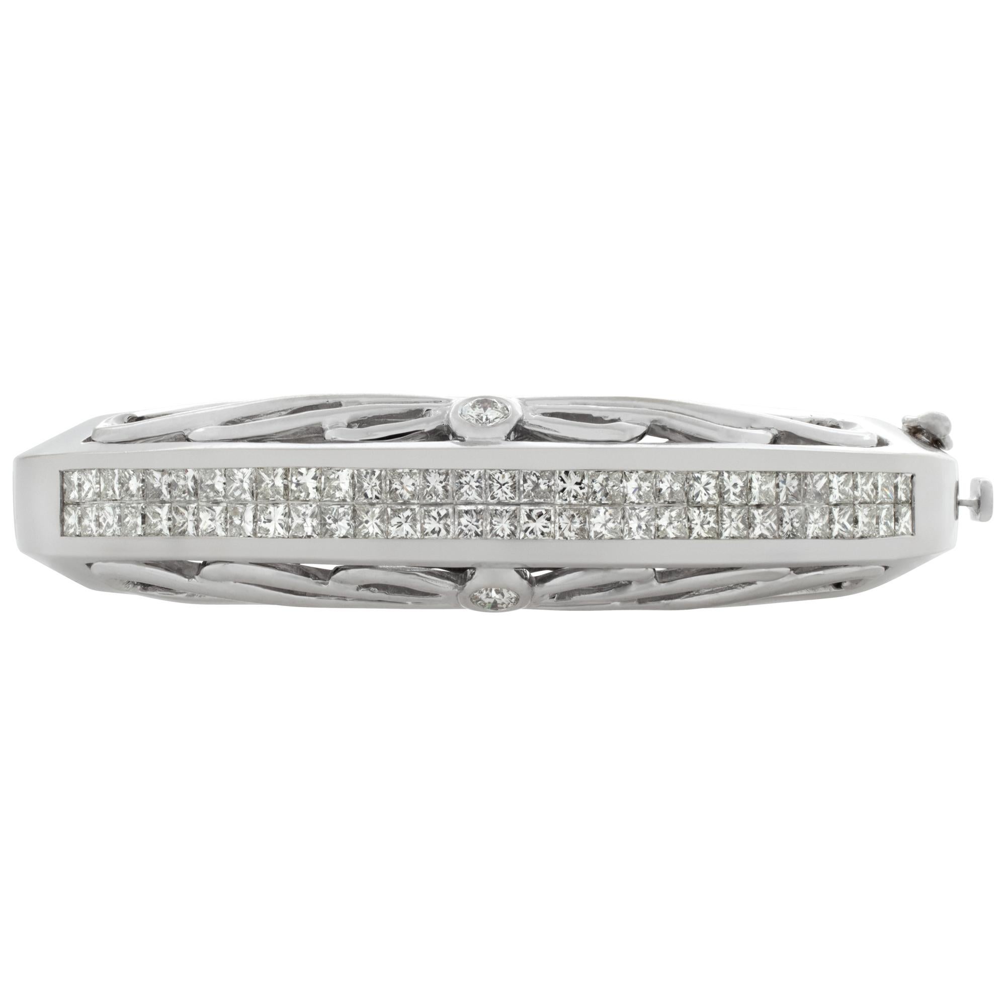 Diamond bangle in 18k white gold with over 3 carats in H color, VS clarity princess cut diamonds. Fits wrist up to 7.5'', width tapers from 13mm x 5mm.
