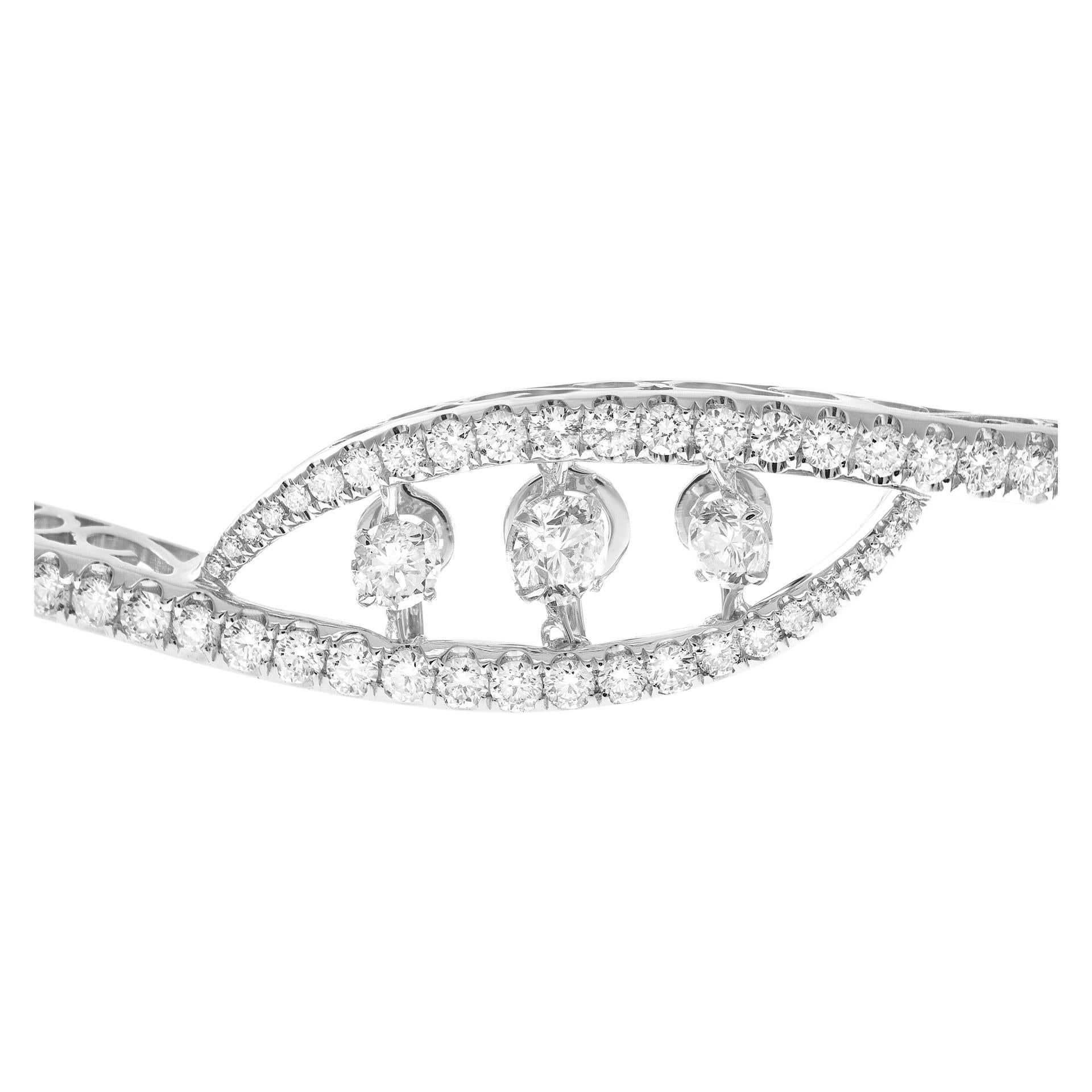 Stunning Diamond Eternity bangle in 18k white gold with center dancing diamonds 0.43 carats and with 2.71cts in diamonds all the way. Fits 6-7 inches.
