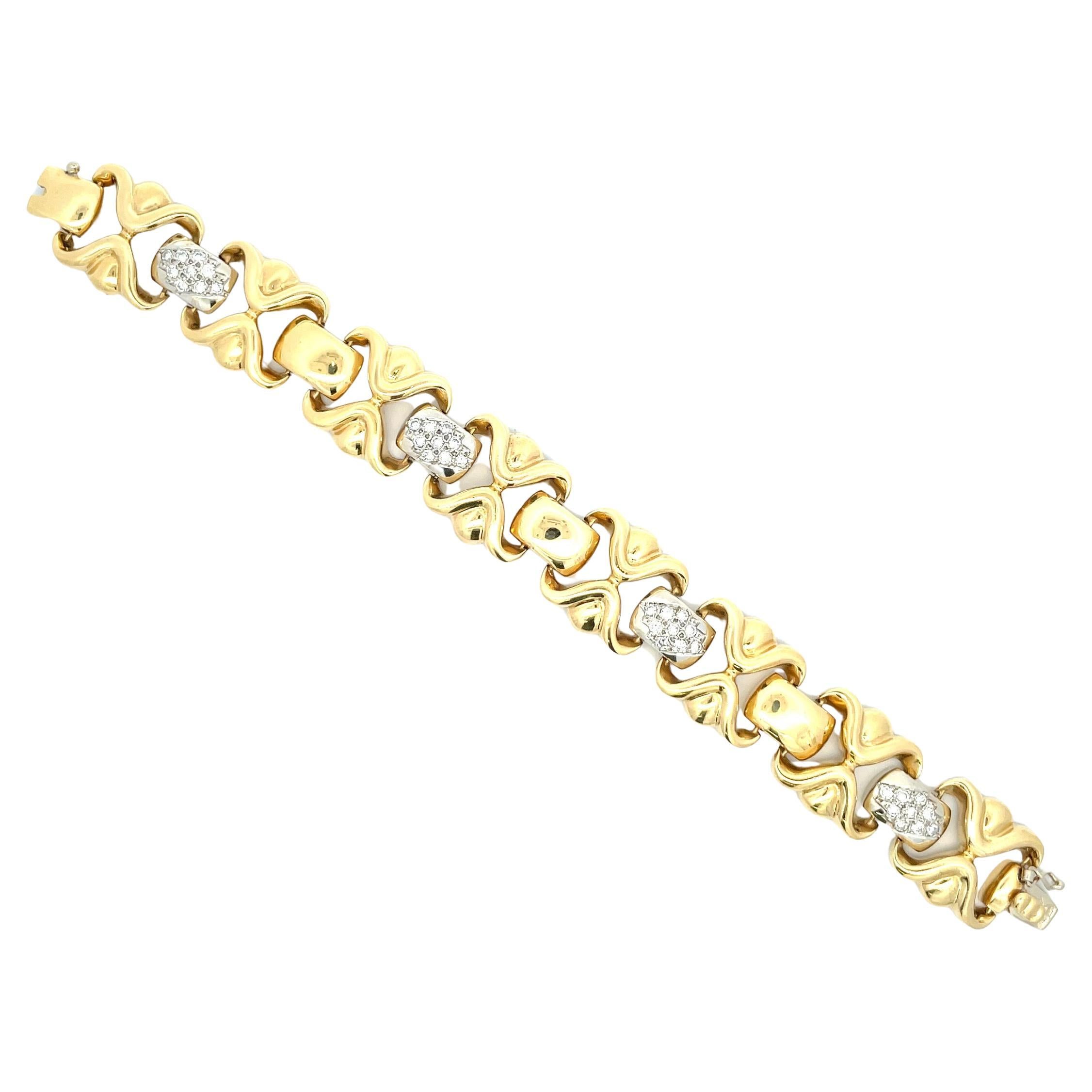 18 Karat yellow gold bracelet featuring 8 gold links with diamond bars in between weighing 1.80 Carats.
63 Grams
Made in Italy
36 Diamonds 
Diamond Bar measures 0.50 inch long
Gold Bar measures 0.73 inch wide x 0.74 long
