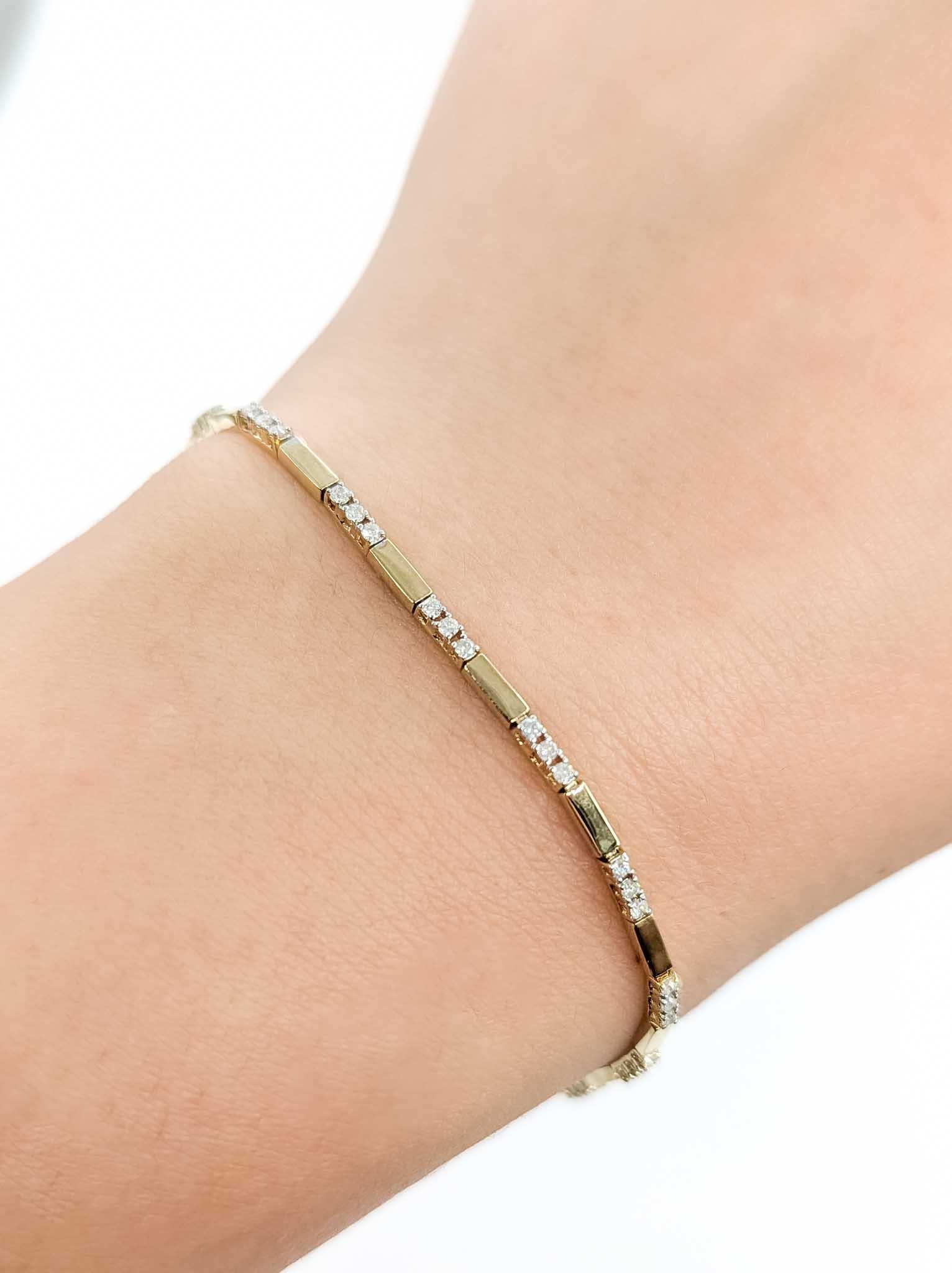 Diamond Bar Link Bracelet in 14k Yellow Gold

This bracelet is crafted in 14k yellow gold and features prong-set diamond, with a bar link design. The round diamonds total 0.50ctw, near colorless with I clarity.

The bracelet measures approximately