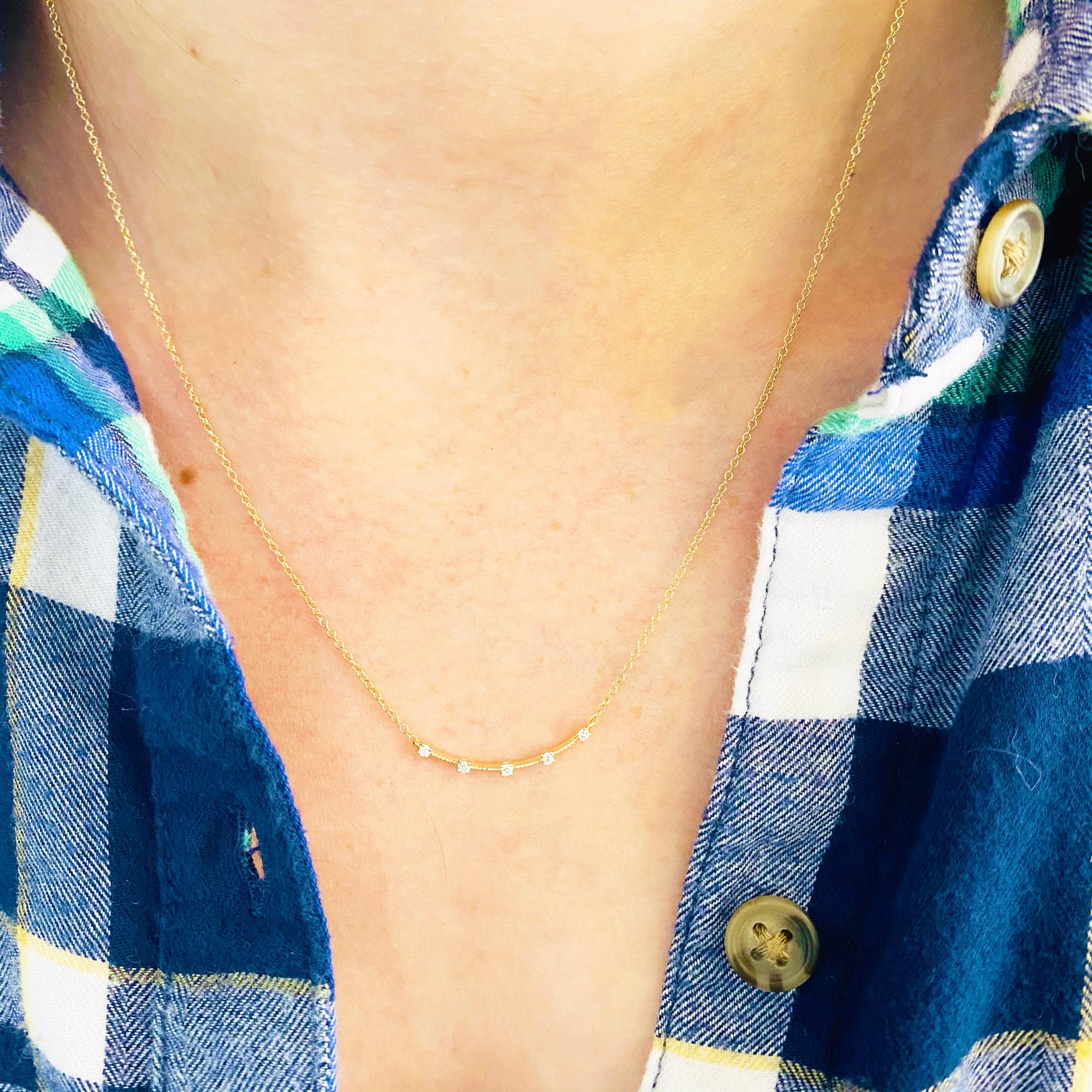 This gorgeous 14k yellow gold curved bar pendant dripping with five brilliant diamonds is sure to put a smile on anyone's face! This necklace looks beautiful worn by itself and also looks wonderful in a necklace stack. This necklace would make a