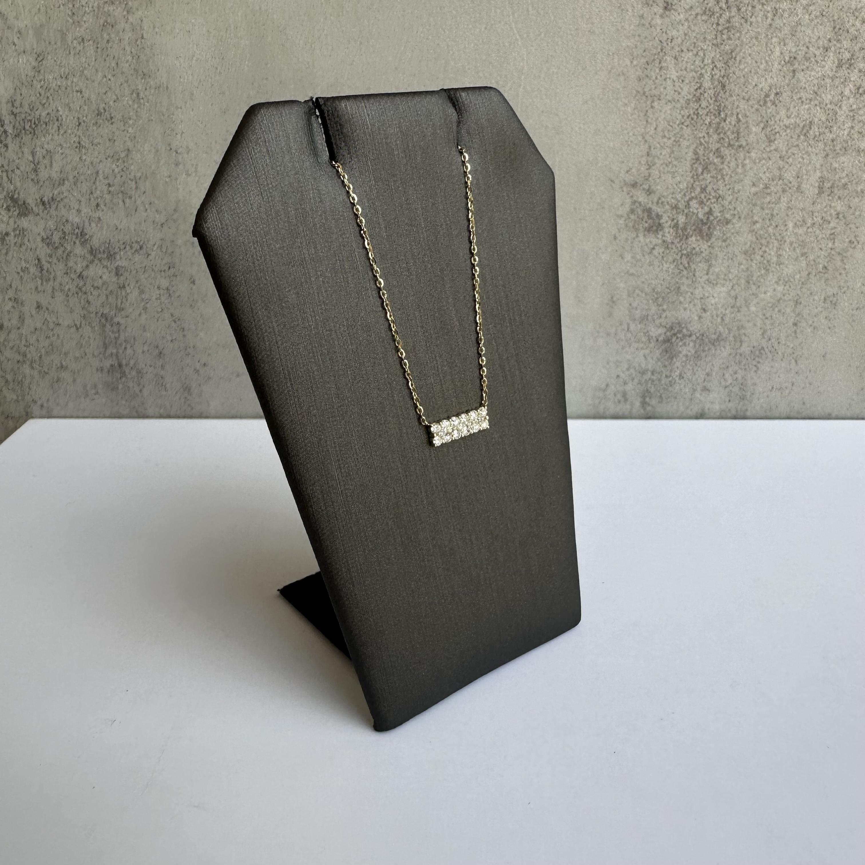 Enhance your jewelry collection with this exquisite Diamond Bar Necklace in 14kt Yellow Gold. Featuring 0.21 carats of GH VS/SI natural round single cut diamonds, this necklace combines timeless beauty with modern elegance, perfect for any