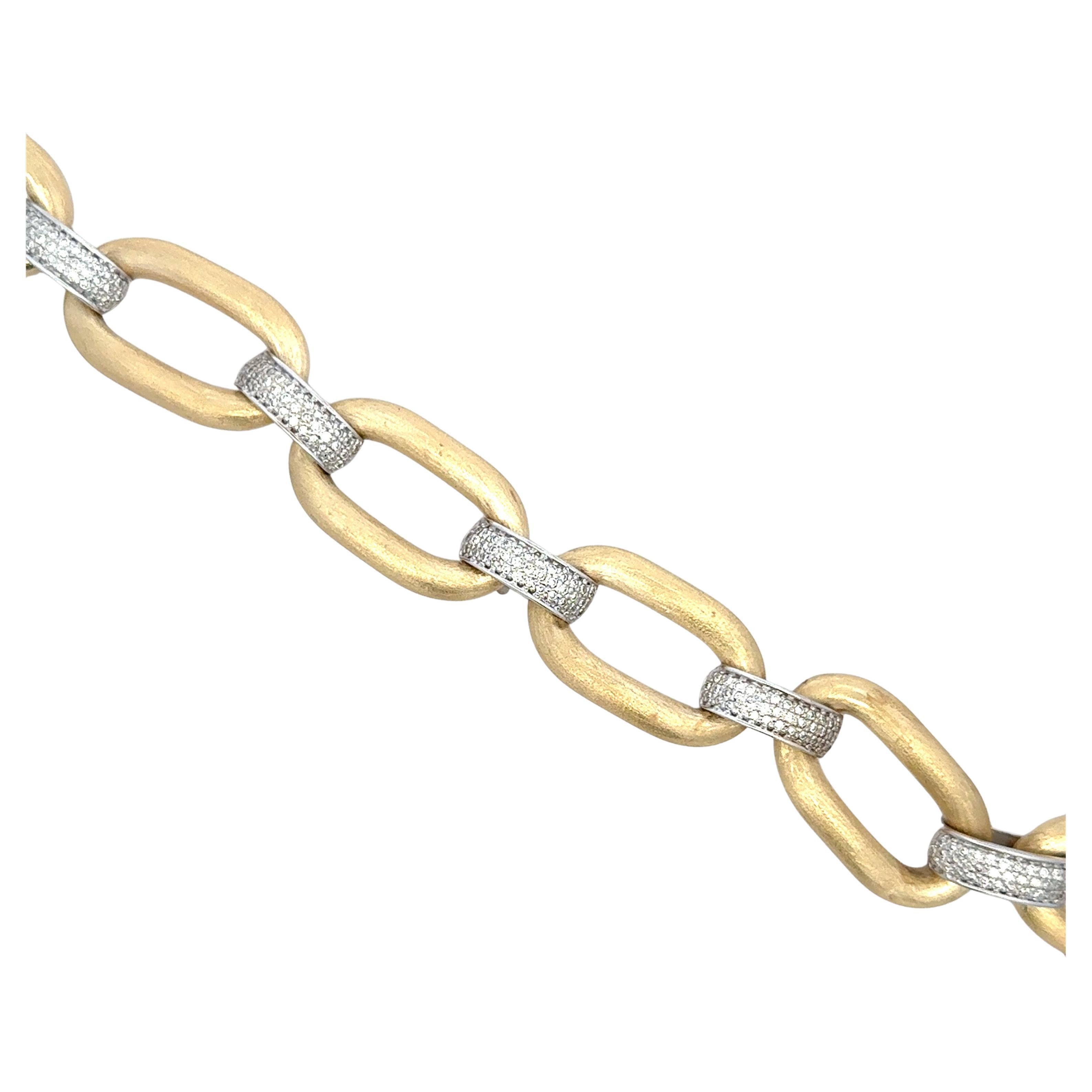 14 Karat yellow gold link bracelet featuring six satin finished oval links with diamond bars in between containing 220 round brilliants weighing 1.82 carats. 
Color I
Clarity VS2

More link bracelets in stock.
Message for pictures and details. 