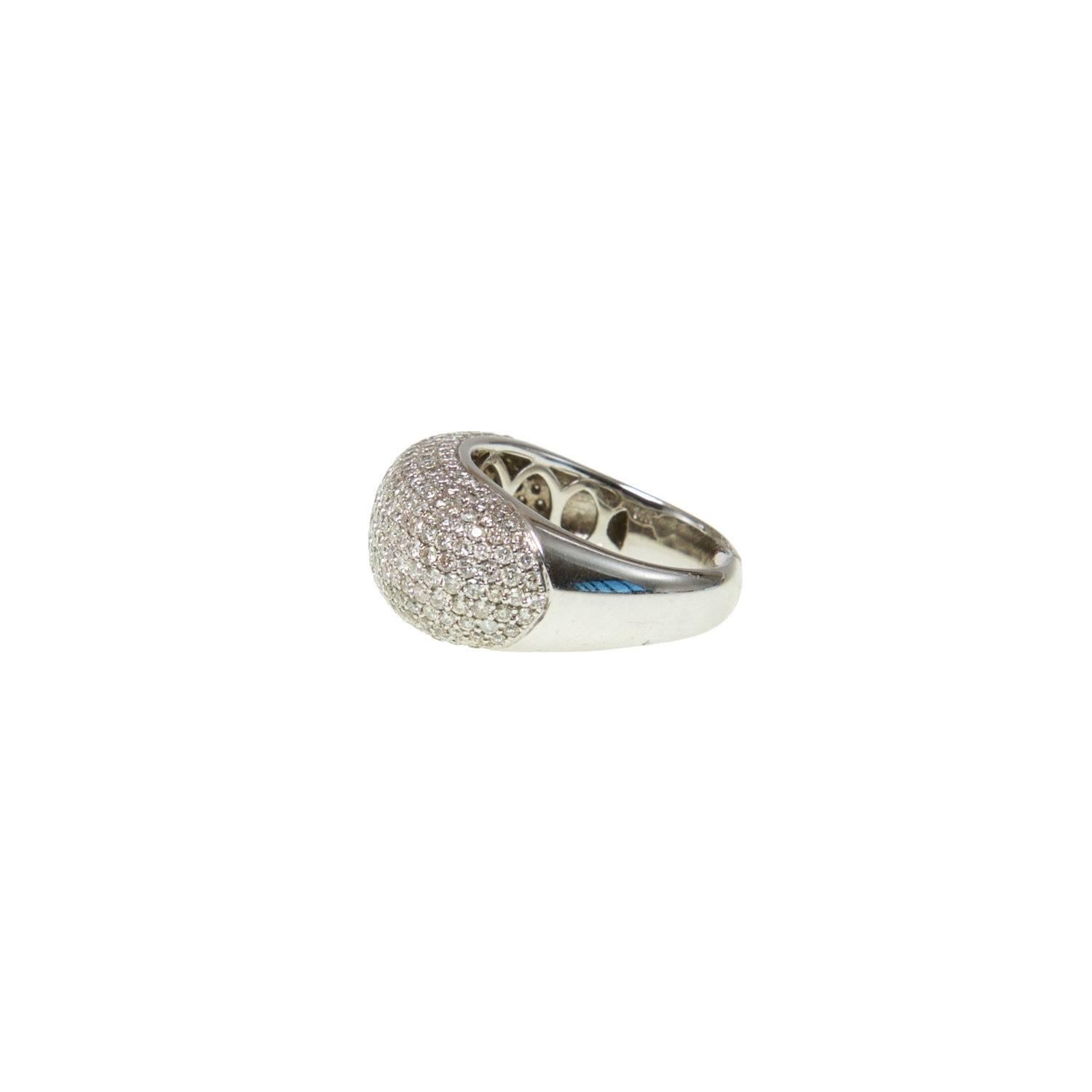 A modern twist on a timeless and classic piece of jewelry, Ri Noor's Diamond Bar Cocktail Ring shimmers in the light creating a dazzling presence on the wearer's finger. The rounded bar ring is covered with brilliant round diamonds in 14k white