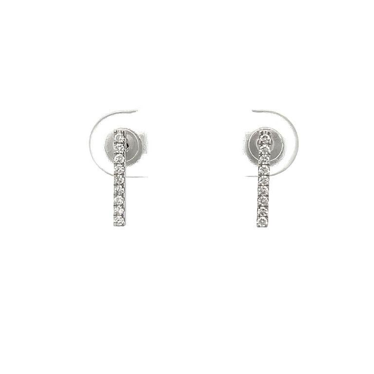Looking for a jewelry piece that highlights both elegance and fine taste? Look no further, our Diamond Bar Studs are the perfect accessory for any occasion. This modern design features a raw of nine white round diamonds set vertically in a total