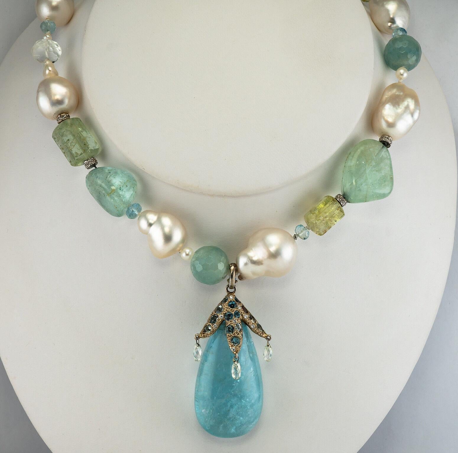 This stunning and spectacular Diamond Baroque Pearl Aquamarine Necklace necklace is definitely one of a kind! The necklace is made with all genuine gemstones: baroque pearls, aquamarines, solid gold and diamonds bead splits, green gemstones, rock