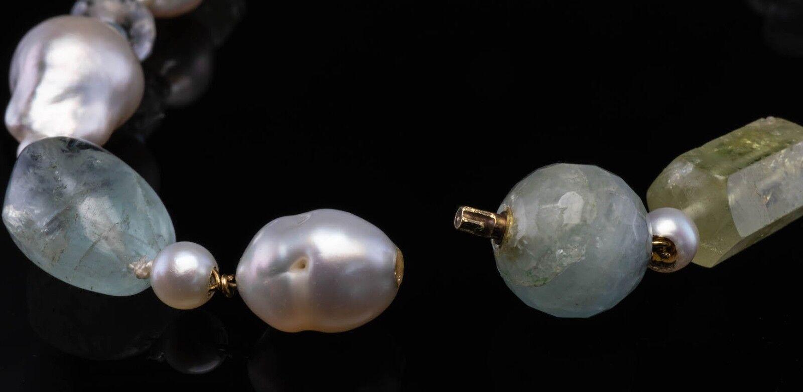 32 inch freshwater baroque pearls with mirror cut aquamarine and 18kt gold rondelles