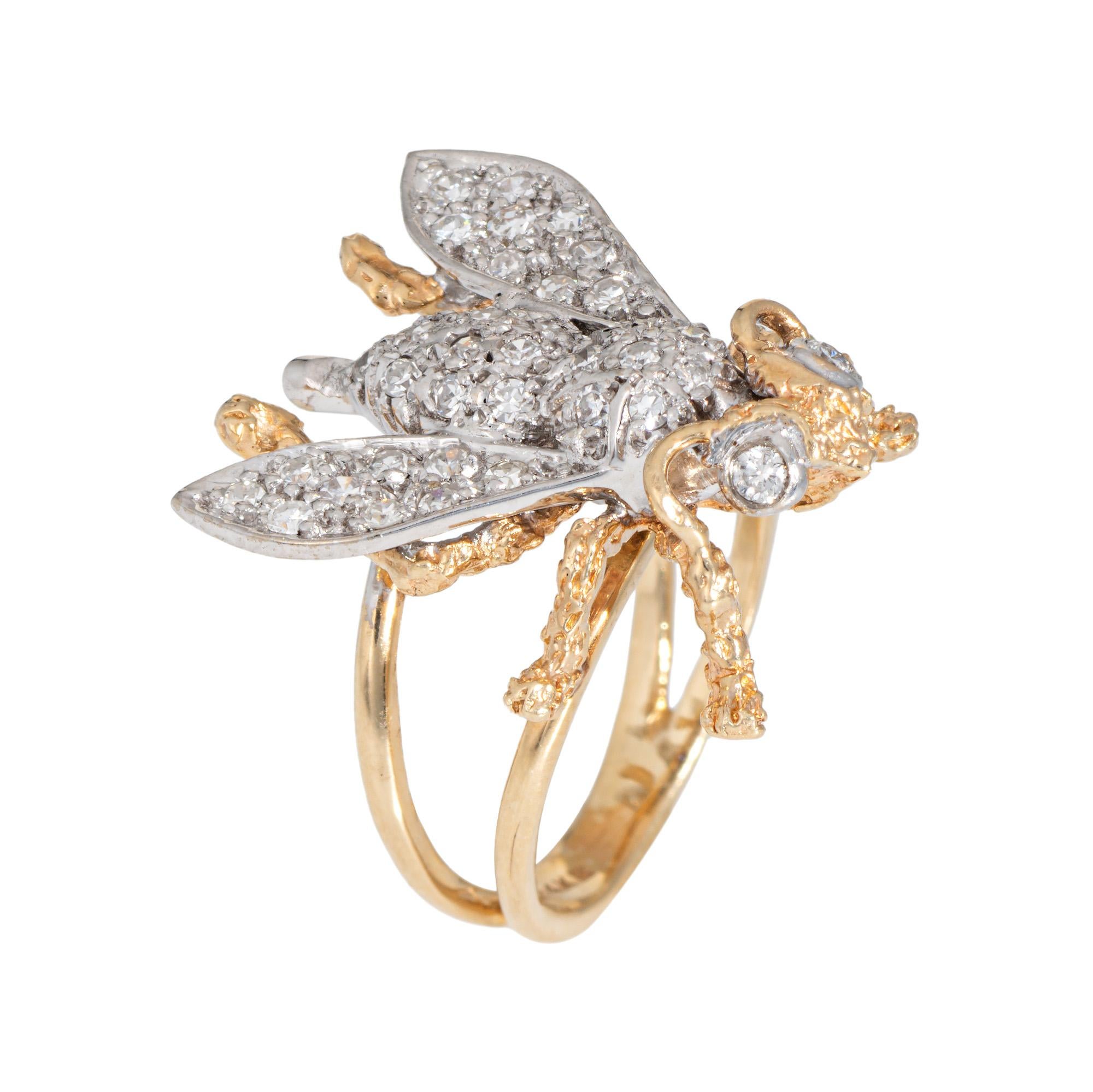 Distinct and unique vintage bee ring crafted in 14 karat yellow & white gold (circa 1970s to 1980s).

Diamonds total an estimated 0.75 carats (estimated at I-J color and VS2-SI2 clarity). 

The bee is a symbol of community and personal power, and we