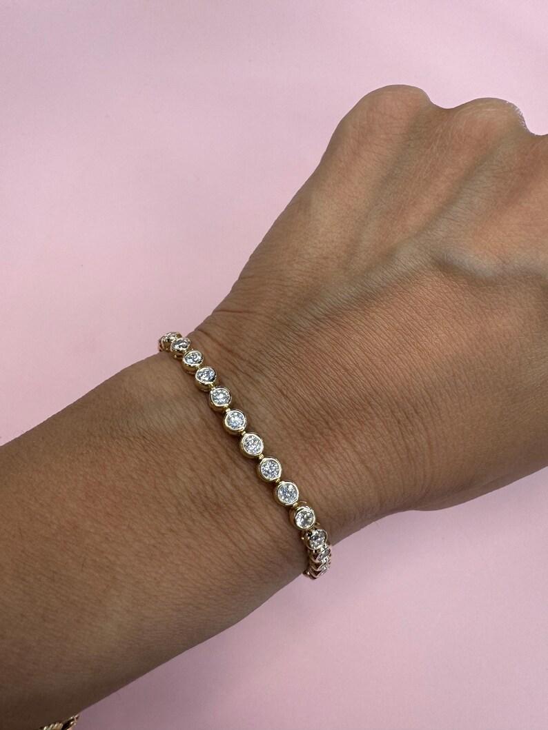 14 Karat yellow gold bolo tennis bracelet featuring 30 round brilliants weighing 2.85 carats in a bezel mounting. 
Color G
Clarity VS2

More Bezel Tennis Bracelets in Stock.
Different Shapes
Message for Pictures & Details. 