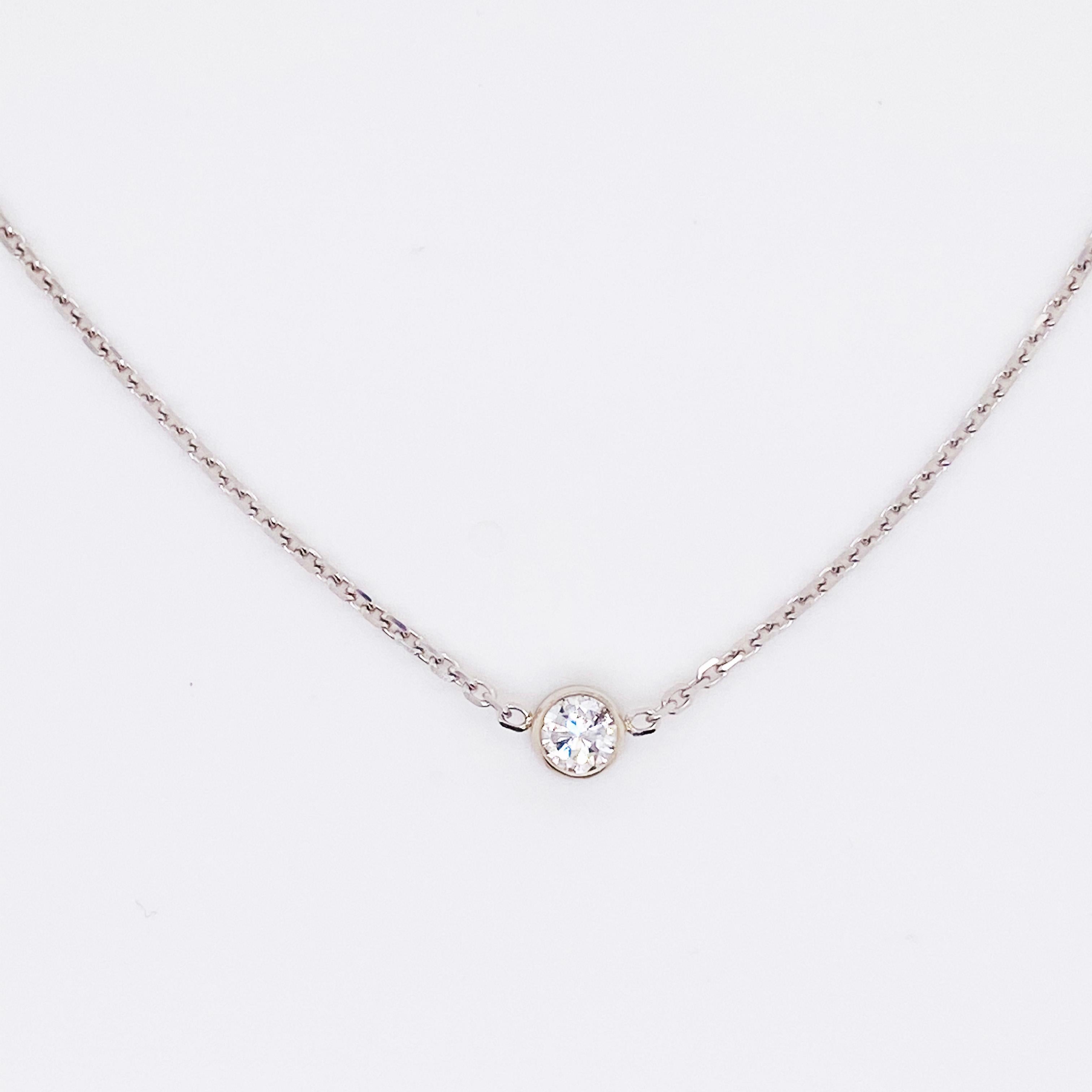 This 14 karat white gold diamond bezel necklace is a classic! This simple design is one to be worn everyday and with any outfit.  You can wear it with your finest dress and also in your workout clothes.  The diamond is lovely and shines from any