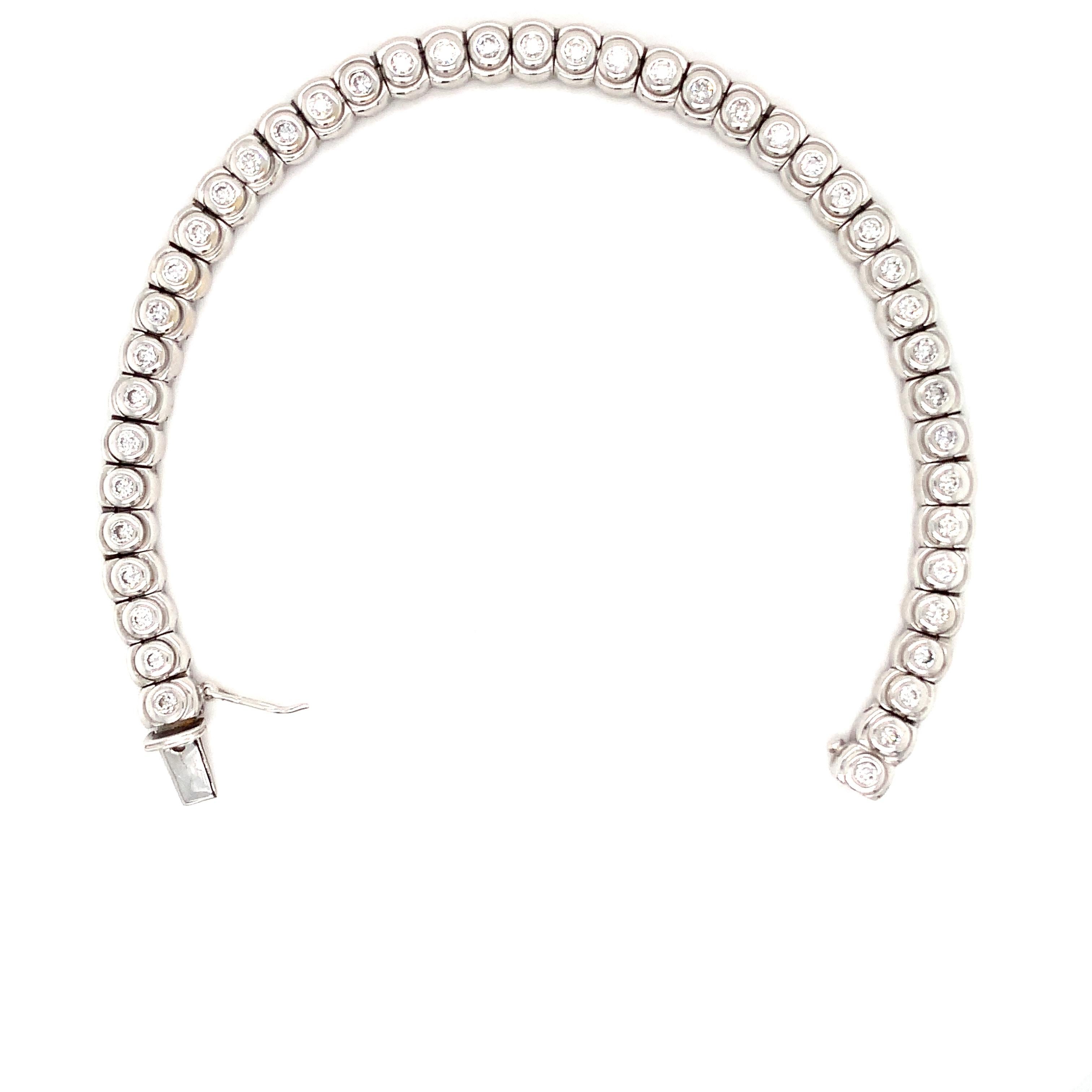 Modern Diamond bezel rub over tennis bracelet 18k white gold For Sale