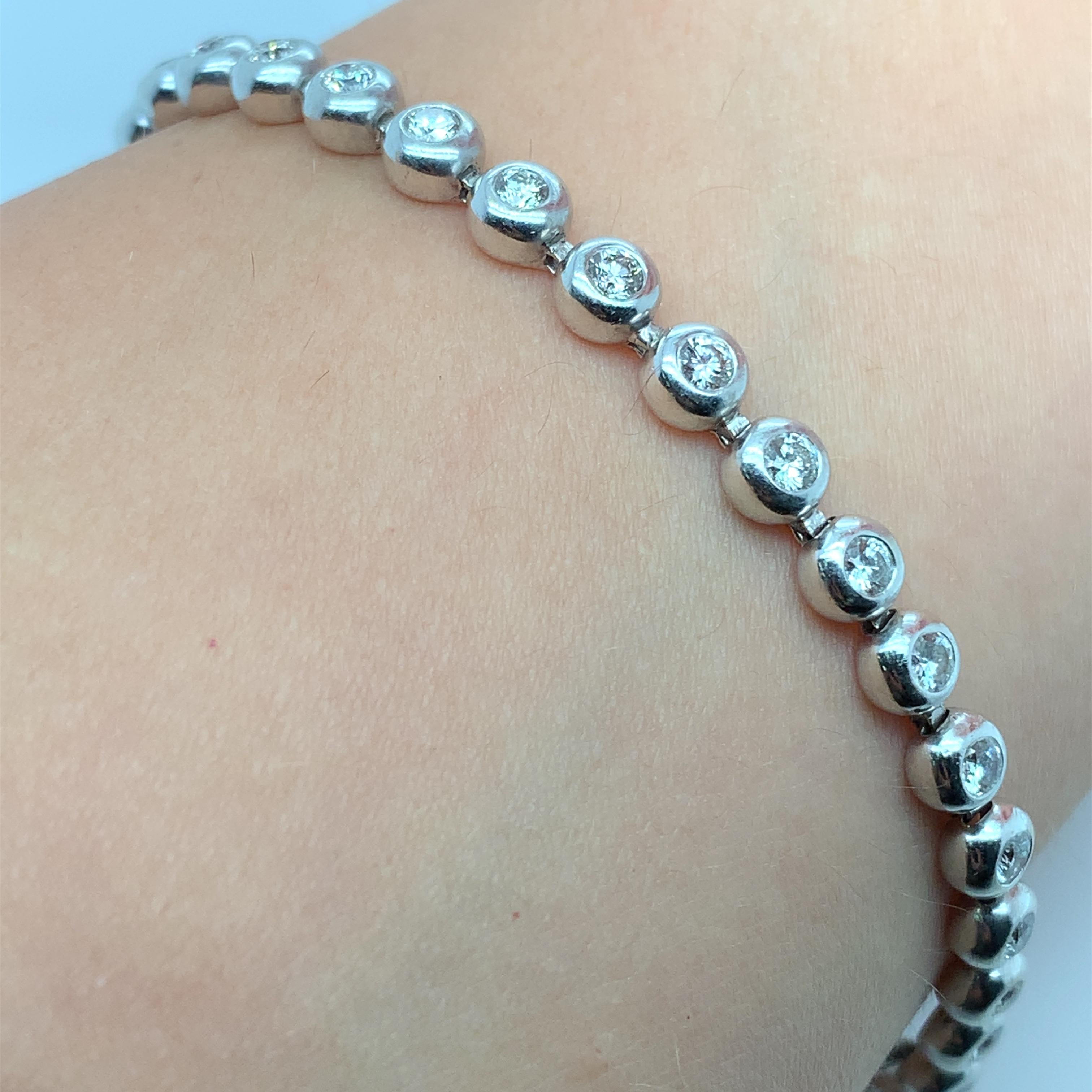 This stunning bracelet is the perfect symbol of everlasting love and commitment. Crafted from 18ct white gold, it features a beautiful round diamond with a total carat weight of 3.80, set in a bezel setting. The bracelet is 7 inches long and has a
