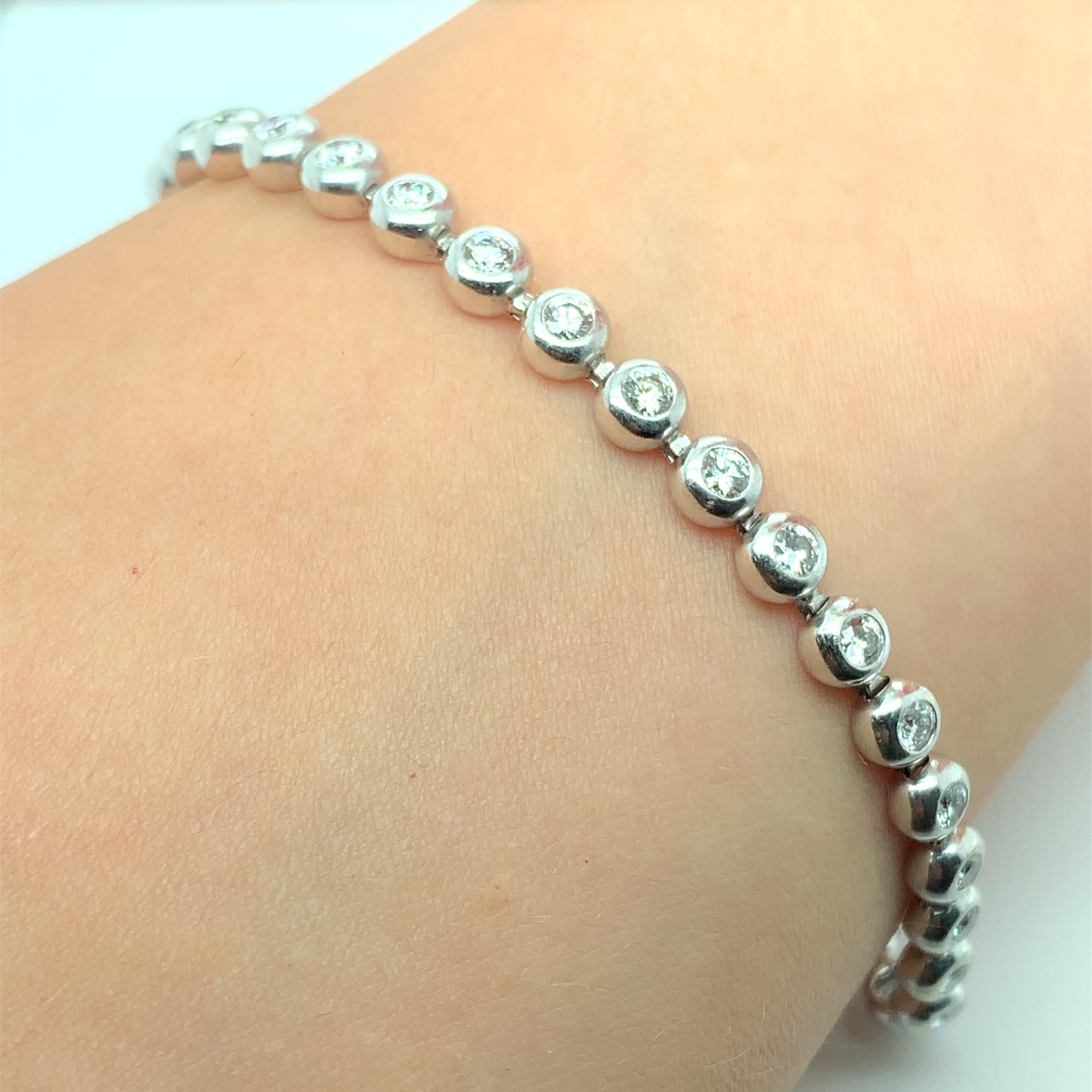 Modern Diamond bezel rubover tennis bracelet 18k white golst For Sale