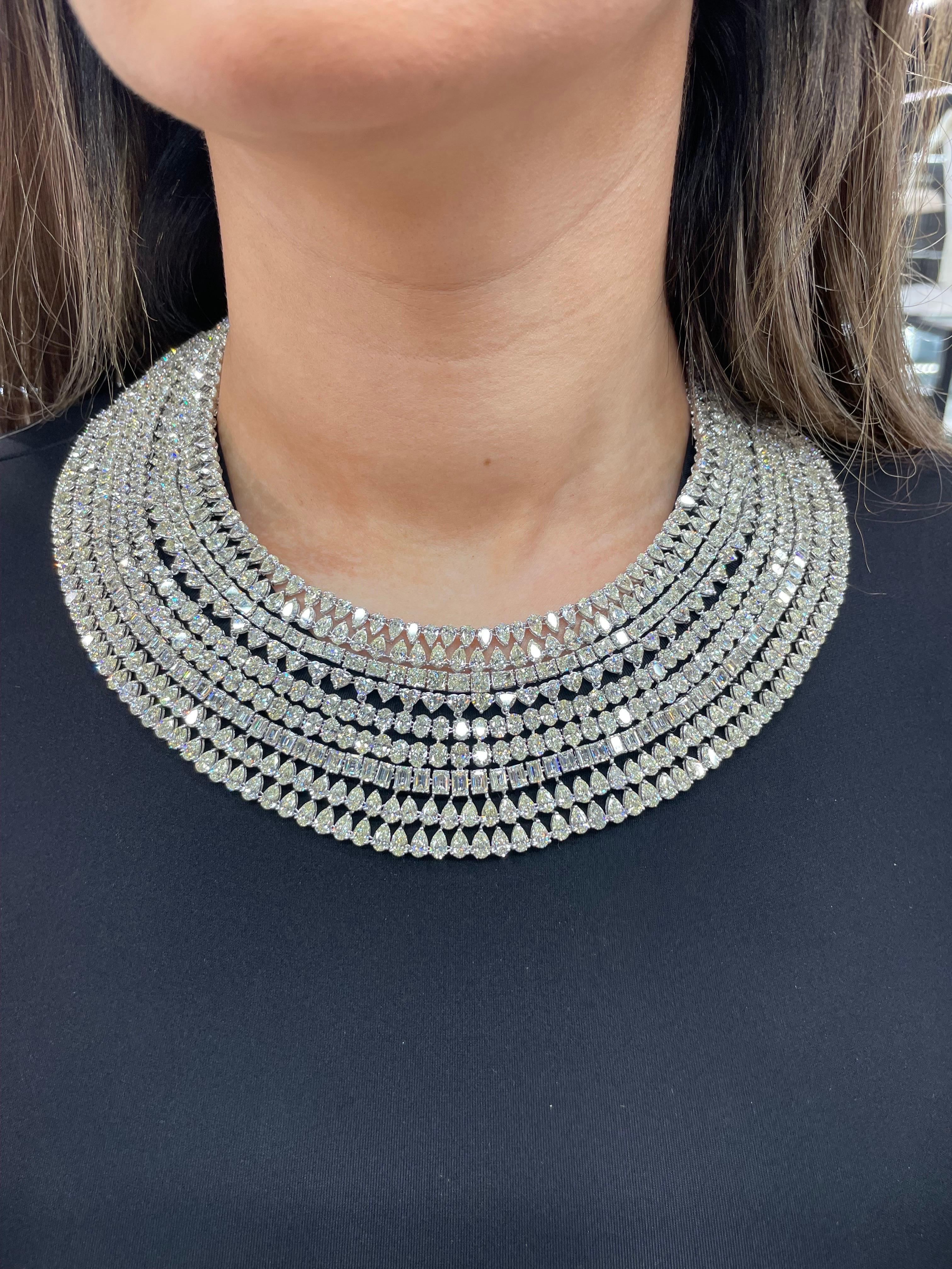 One oversized diamond bib necklace featuring numerous rows of Pear, Radiant, Heart, Oval and Emerald Cut Diamonds weighing an astounding 265 Carats, crafted in 18 Karat White Gold. 
Nicely matched diamonds of J-L Color
Comfortable on the neck.

DM
