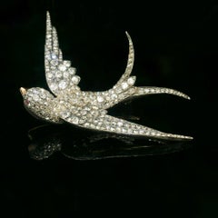Diamond bird brooch, gold and silver
