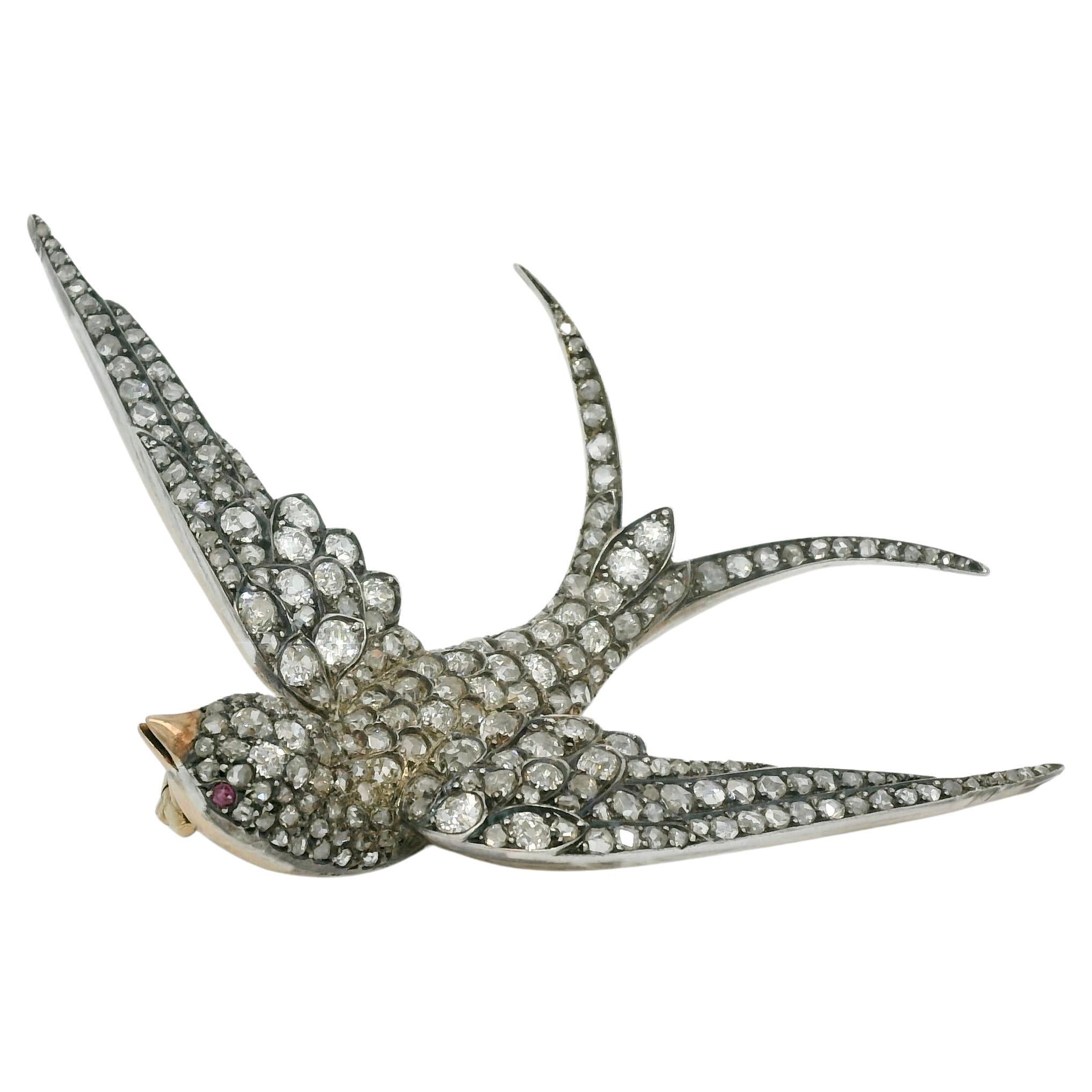 Diamond bird brooch, gold and silver