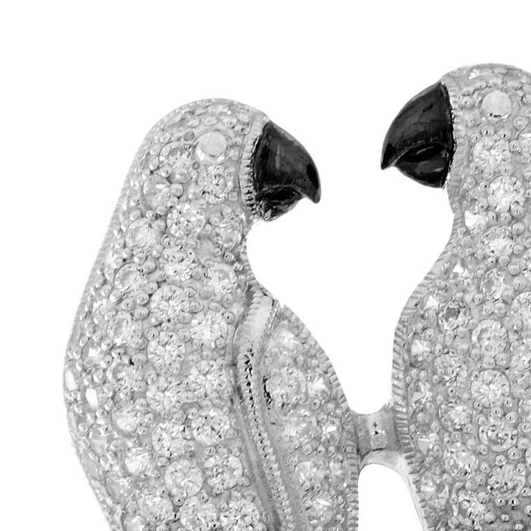 Exquisite Love Birds Brooch in Art Deco style, set with a 14 Karat with a 1.6 mm. 126 pieces brilliant-cut Diamond (H/SI) approx 2.21 Carat.
Further decorated Black Enamel at the bird's mouth.

The brooch measure 26x44 mm.
Approx weight 12.08 g.

If