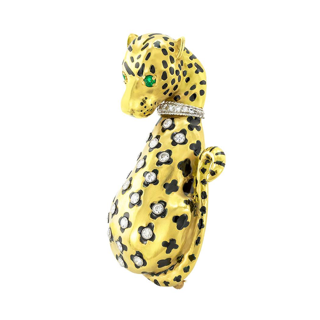 Diamond black enamel and yellow gold leopard brooch circa 1970. *

ABOUT THIS ITEM:  a big leopard with emerald eyes and diamond spots, what is there not to like about that?  This brooch easily tames the sleek and fierce nature of a magnificent wild