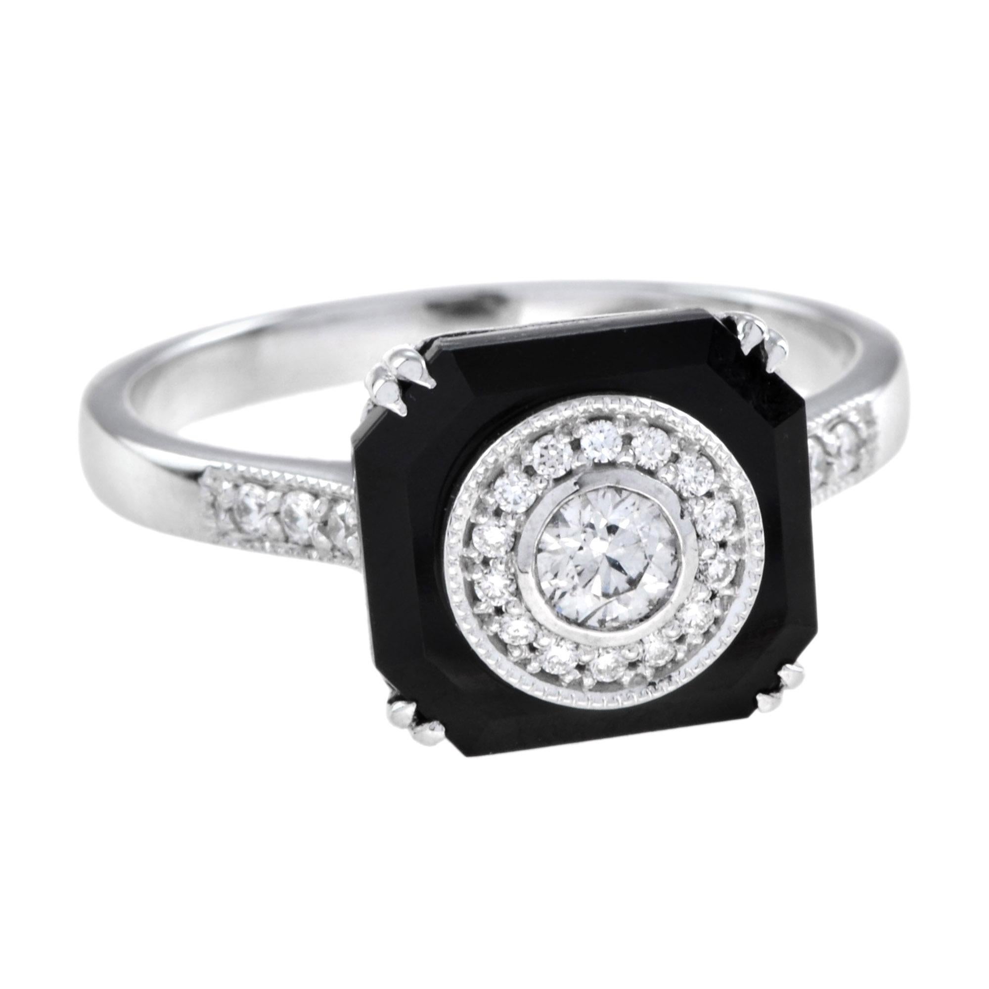 Un anello aureolato con diamanti e onice in stile Art Déco di grande effetto e raffinatezza. Un totale di 0,28 carati di diamanti sono incastonati in un onice di forma ottagonale. Un pezzo straordinario da abbinare al tuo look di tutti i giorni. Oro